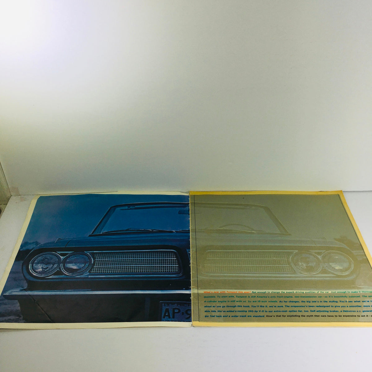 Visual of the interior spread of the 1963 Pontiac Tempest dealership brochure, displaying the car's front design and promotional text.