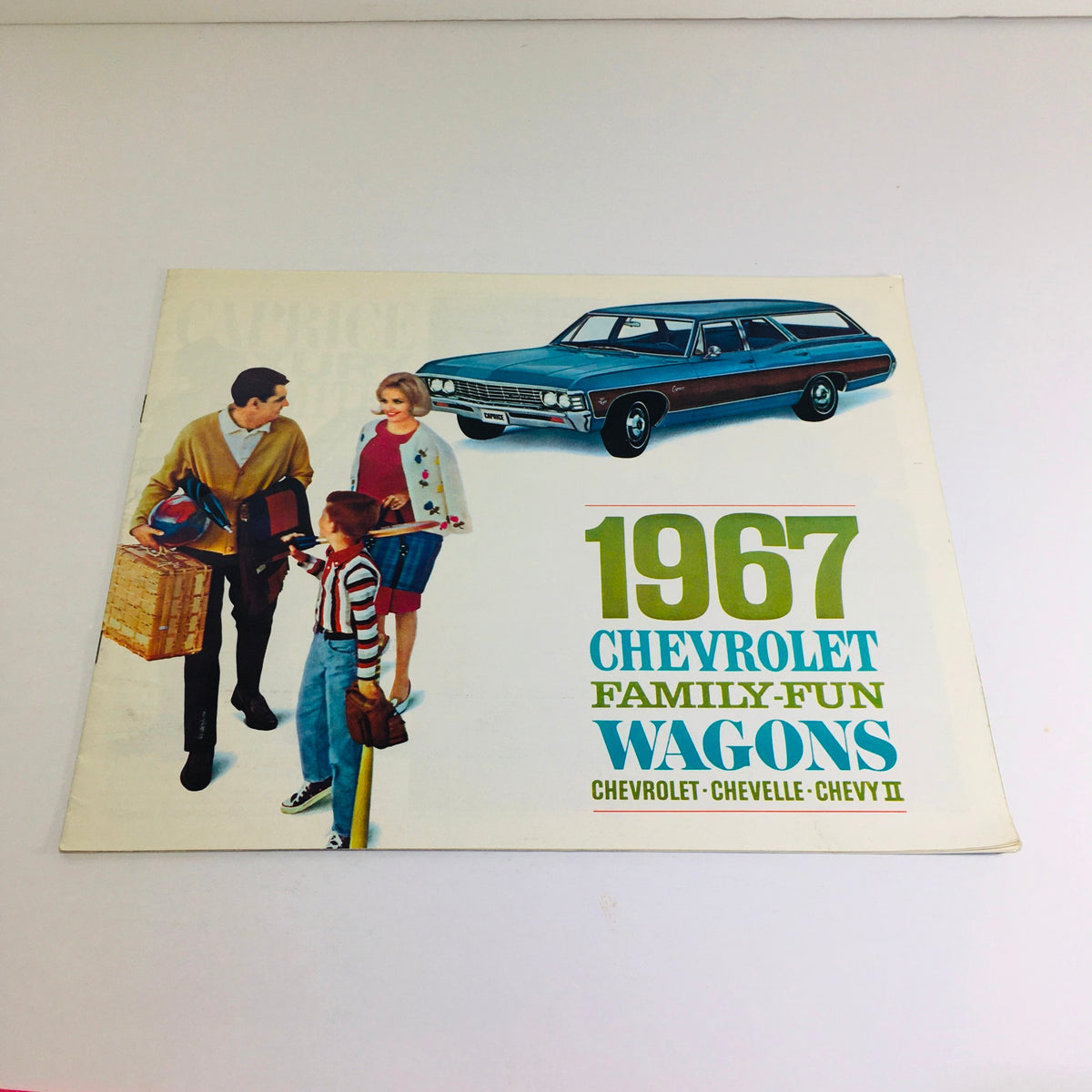 1967 Chevrolet Family-Fun Wagons Chevelle Chevy II Car Auto Brochure Catalog cover featuring a family with picnic items standing beside a station wagon.