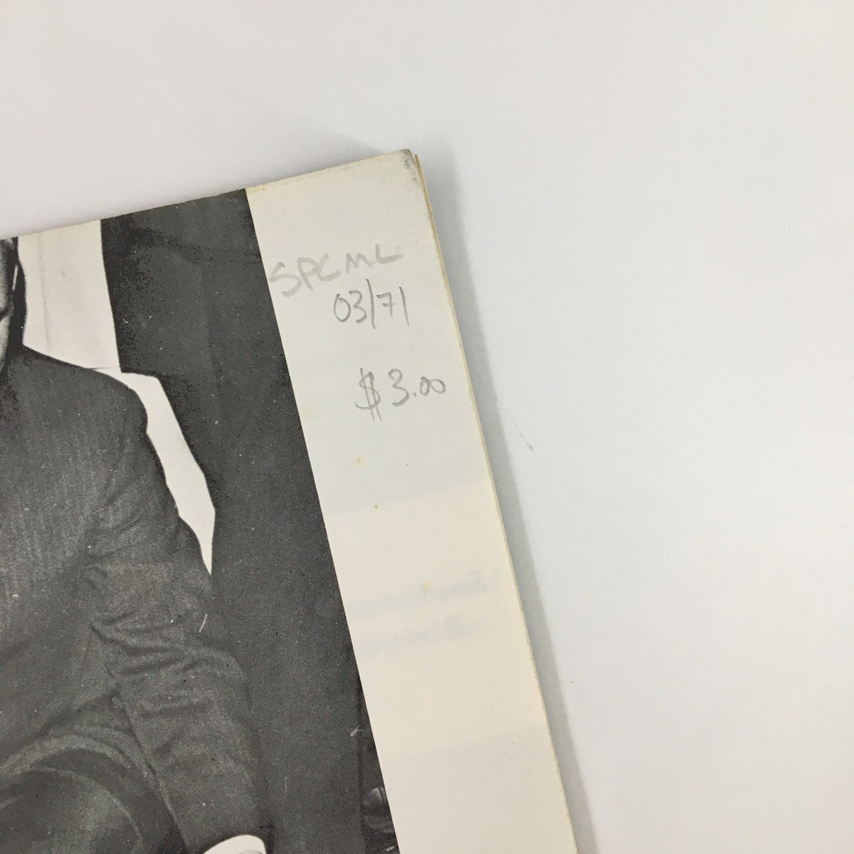 Close-up of VTG Sports Car Magazine March 1971 showing Oscar Koveleski, with a handwritten price and date. This image highlights the magazine's details and condition.