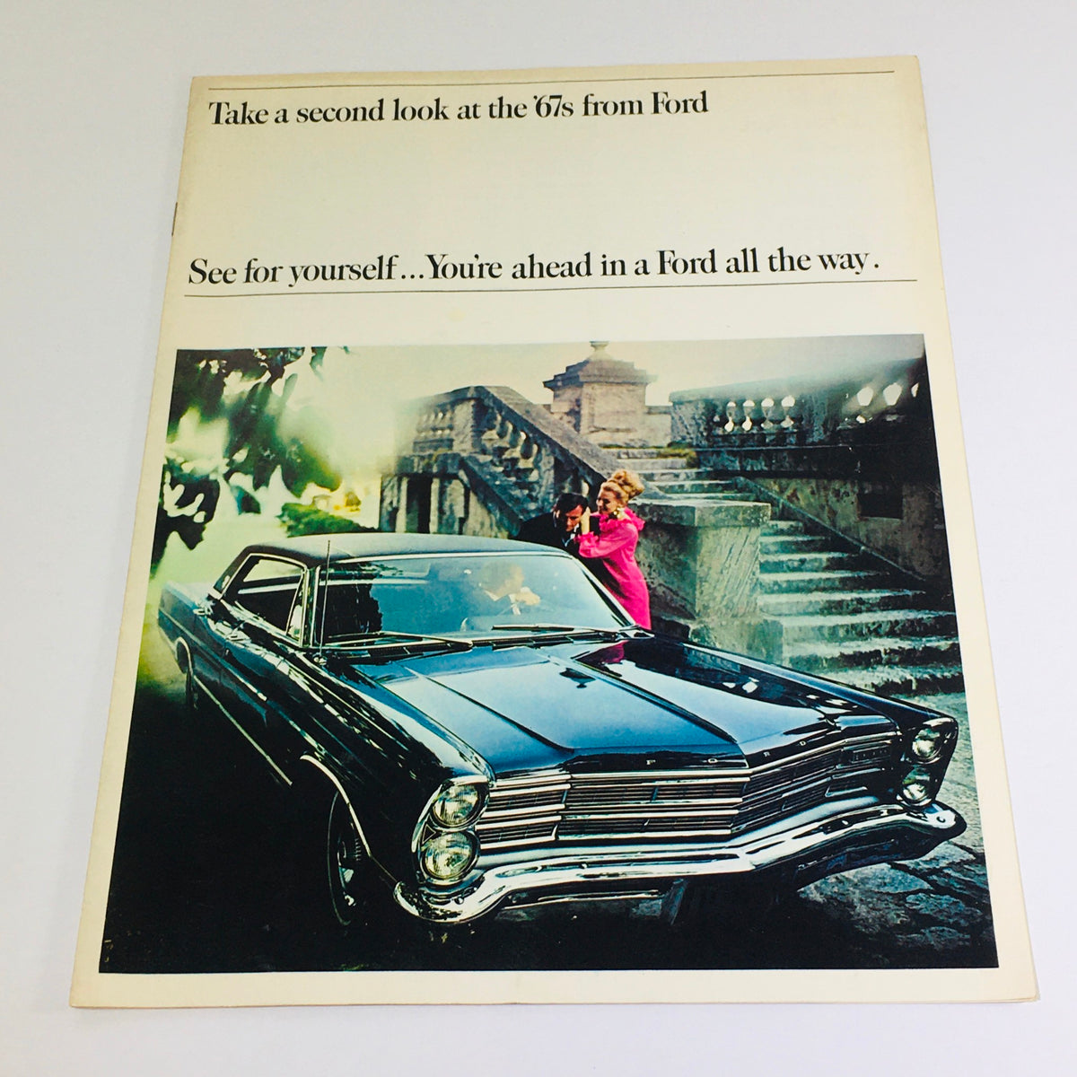 1967 Ford Galaxie 500/XL Sedan Dealership Car Auto Brochure Catalog featuring a stylish black Ford car with two elegantly dressed individuals in a romantic setting.