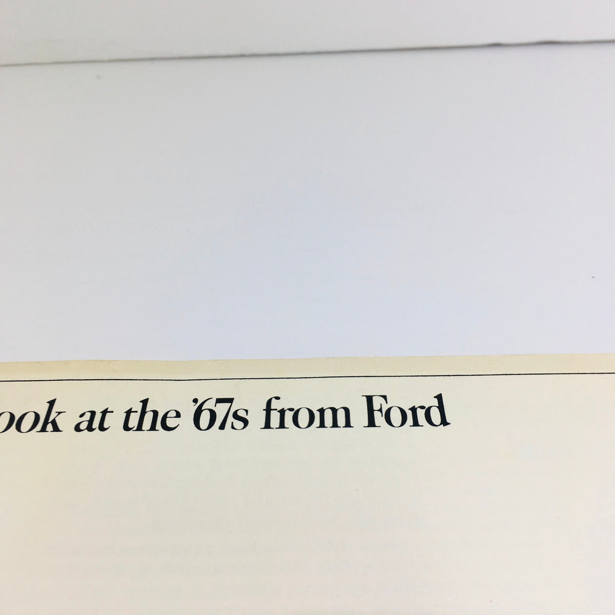 Close-up view of the text on the cover of the 1967 Ford Galaxie 500/XL Sedan Dealership Car Auto Brochure Catalog reading 'Take a second look at the '67s from Ford'.