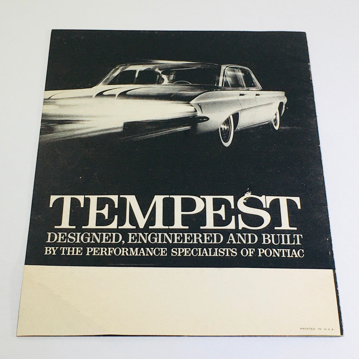 1961 Pontiac Tempest Showroom Dealership Car Auto Brochure Catalog cover showcasing the sleek design of the Pontiac Tempest, highlighting its engineering and performance.