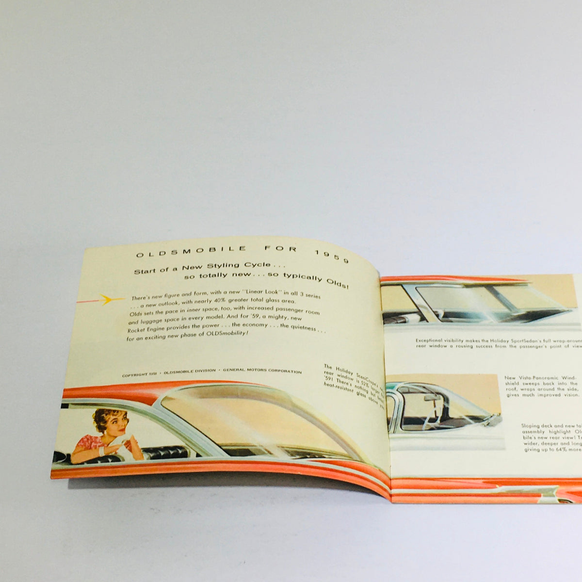 Inside page of the 1959 Oldsmobile Holiday SceniCoupe Dealership Car Auto Brochure Catalog highlighting new features and styling for the year, with illustrations and descriptions.
