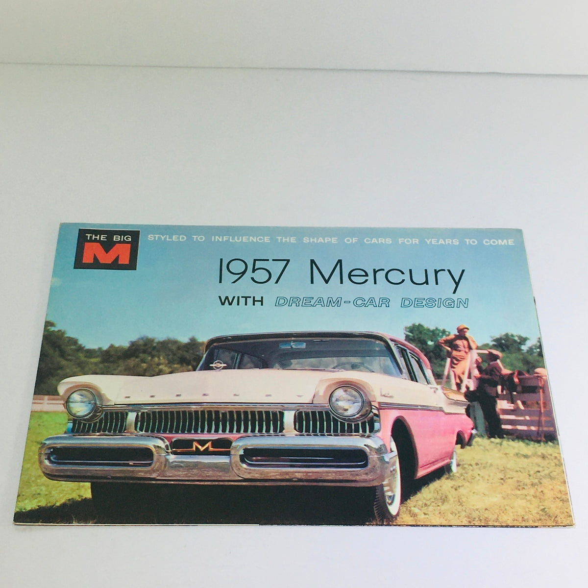 1957 Mercury Montclair Series Sedans Dealership Car Auto Brochure Catalog featuring a classic Mercury vehicle with a prominent front grille, set against a lush green background.
