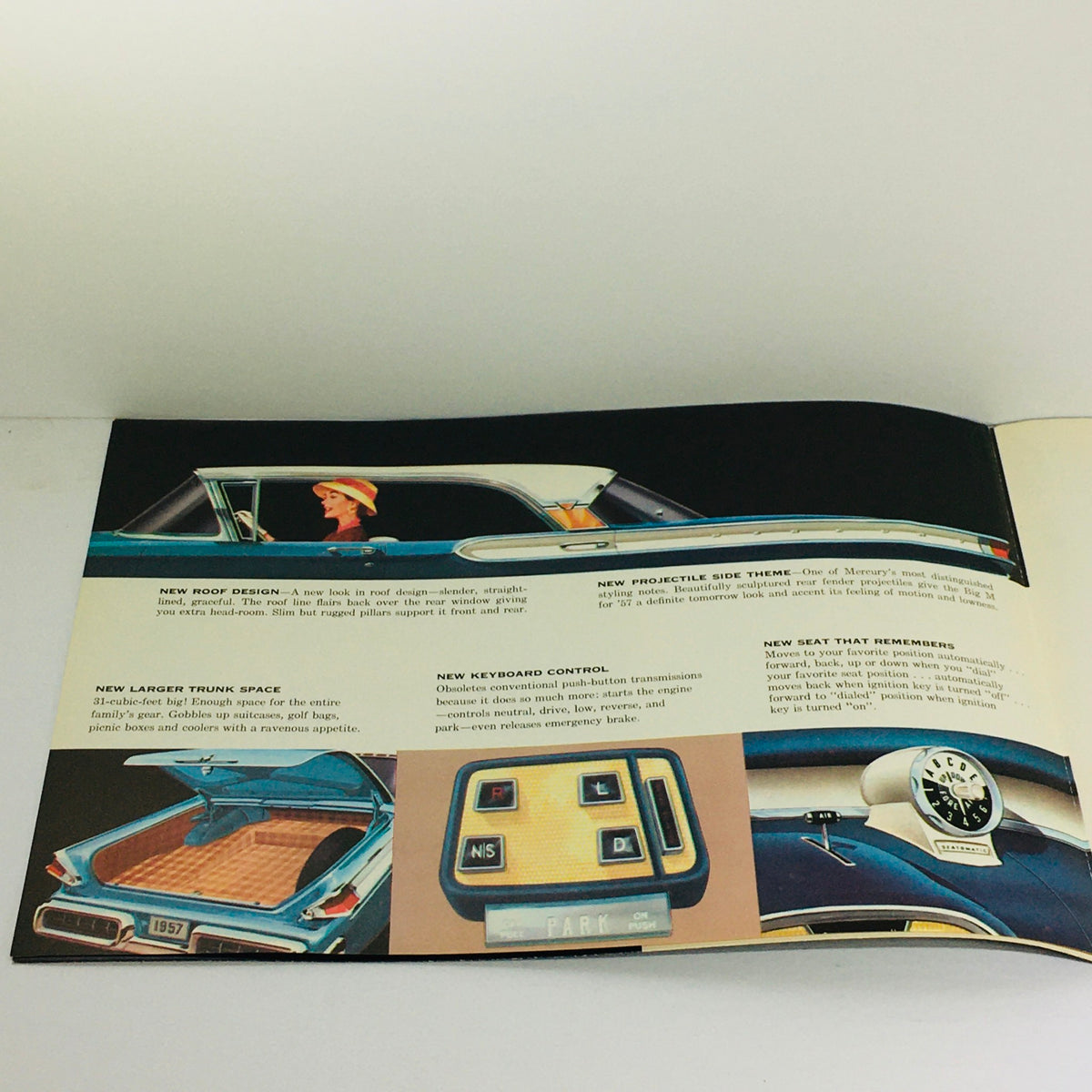 Interior view from the 1957 Mercury Montclair Series Sedans Dealership Car Auto Brochure Catalog showcasing a new roof design, trunk space, and dashboard controls with colorful illustrations.