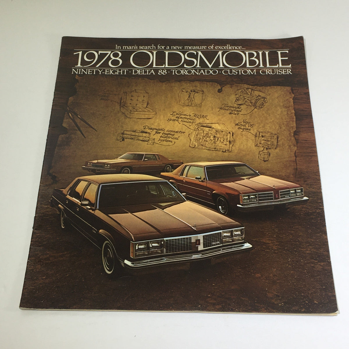 Cover of the 1978 Oldsmobile Ninety-Eight, Delta 88, Toronado, Cruiser Car Brochure Catalog, featuring detailed depictions of classic Oldsmobile cars against a textured background.