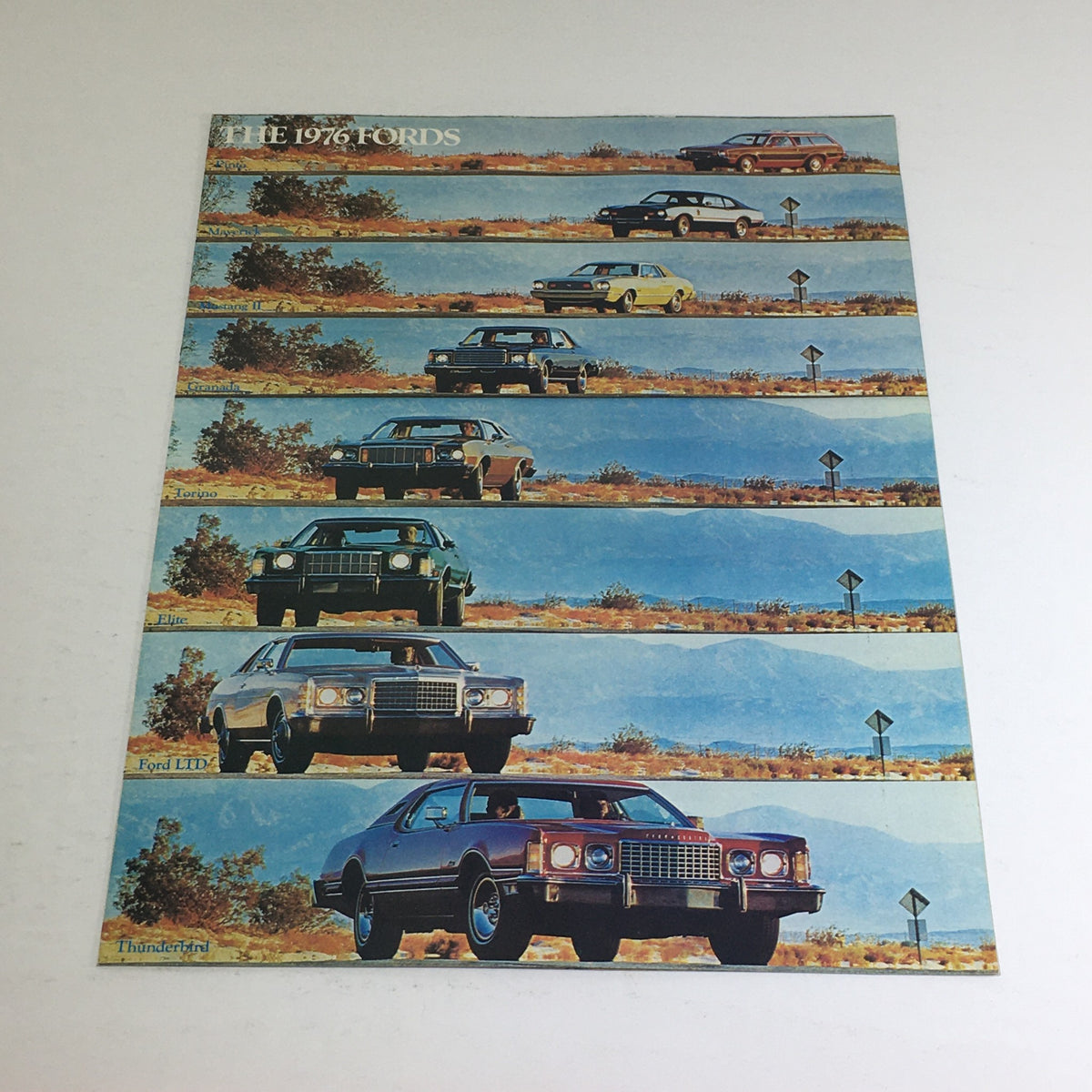 1976 Ford LTD, Granada Ghia Thunderbird Specifications Auto Brochure featuring various Ford models showcased in a scenic landscape.