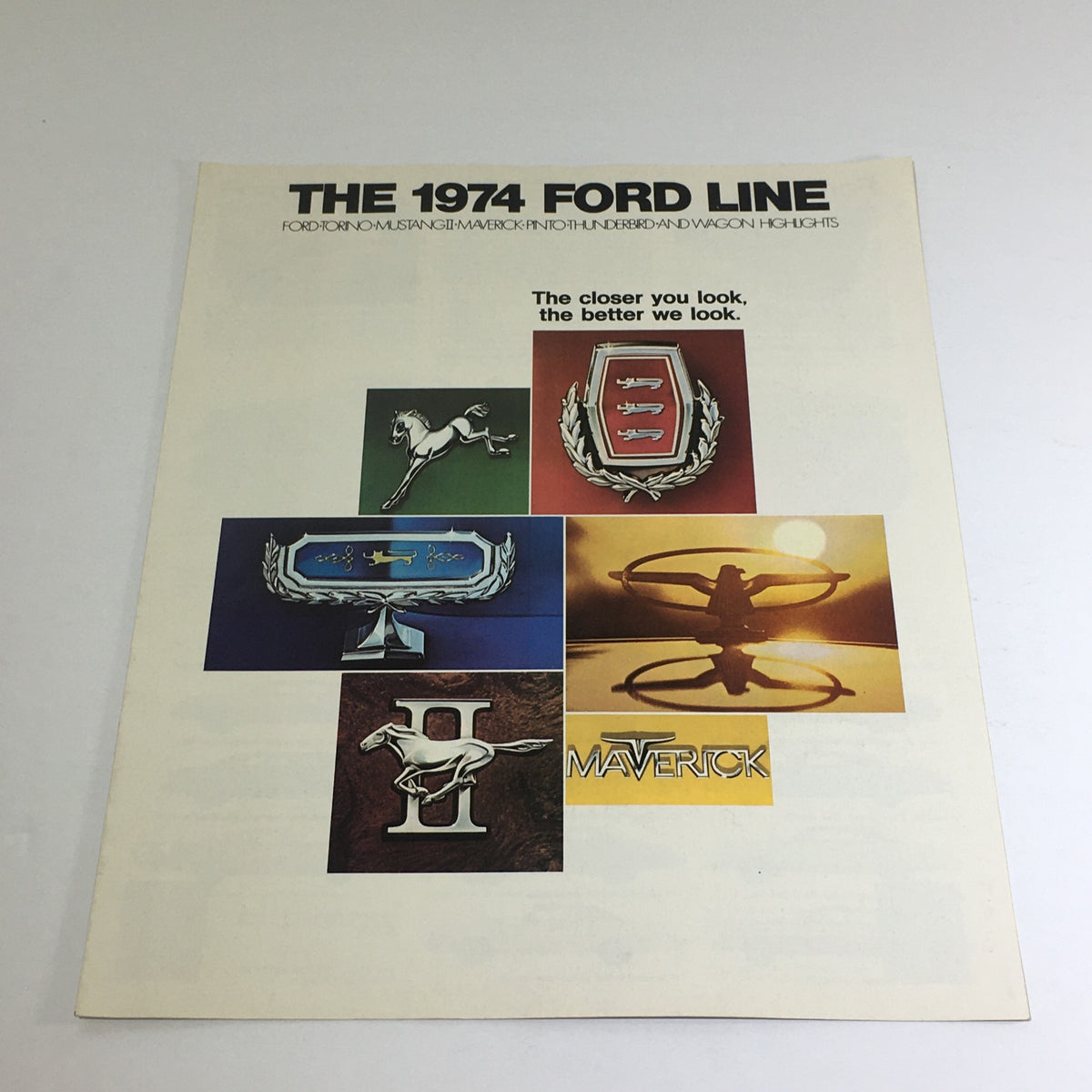 Cover of the 1974 Ford Torno/Mustang II/Maverick Dealership Car Auto Brochure Catalog featuring various Ford car logos and the tagline 'The closer you look, the better we look.'