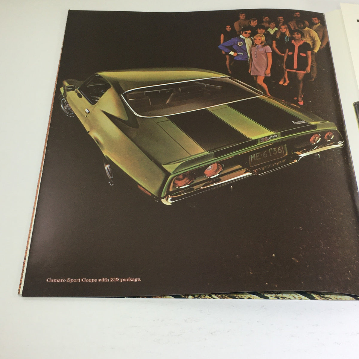 1970 Chevrolet Camaro Sport Coupe Z-25 Dealership Car Auto Brochure Catalog featuring a green Camaro with Z28 package and a group of people in the background.