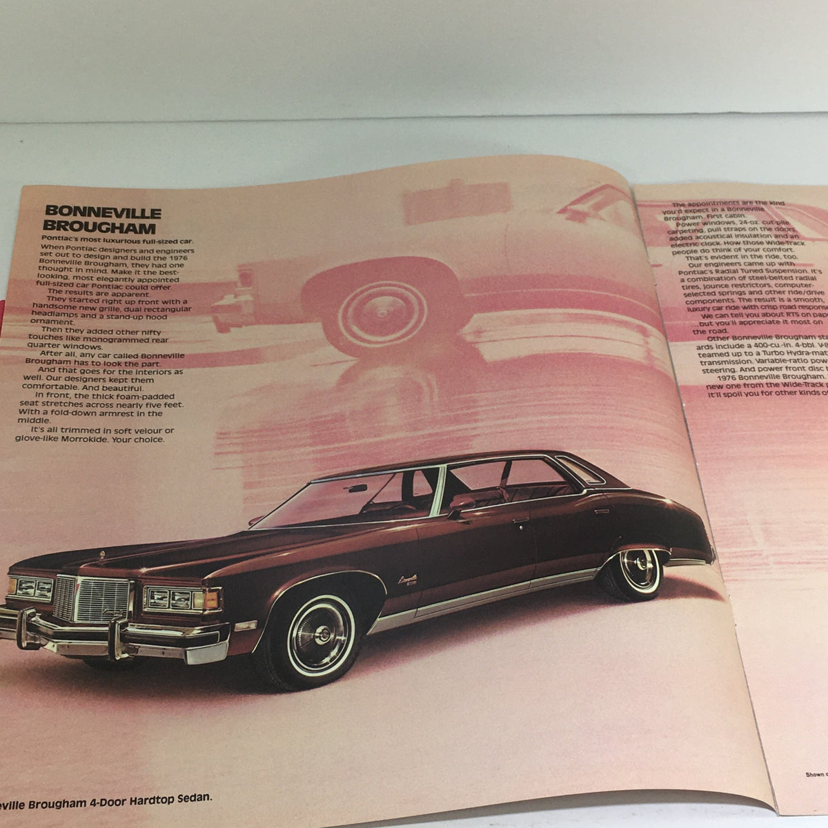 Interior view of the 1976 Pontiac Bonneville Brougham Catalina brochure, highlighting the luxurious features and sleek design of the car, emphasizing the craftsmanship and comfort of the model.