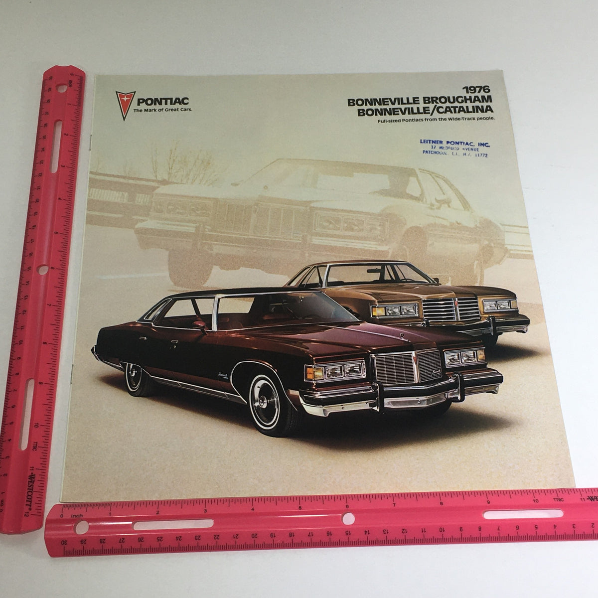 1976 Pontiac Bonneville Brougham Catalina Facts & Figures Auto Brochure Catalog cover featuring illustrated Pontiac cars with promotional text.