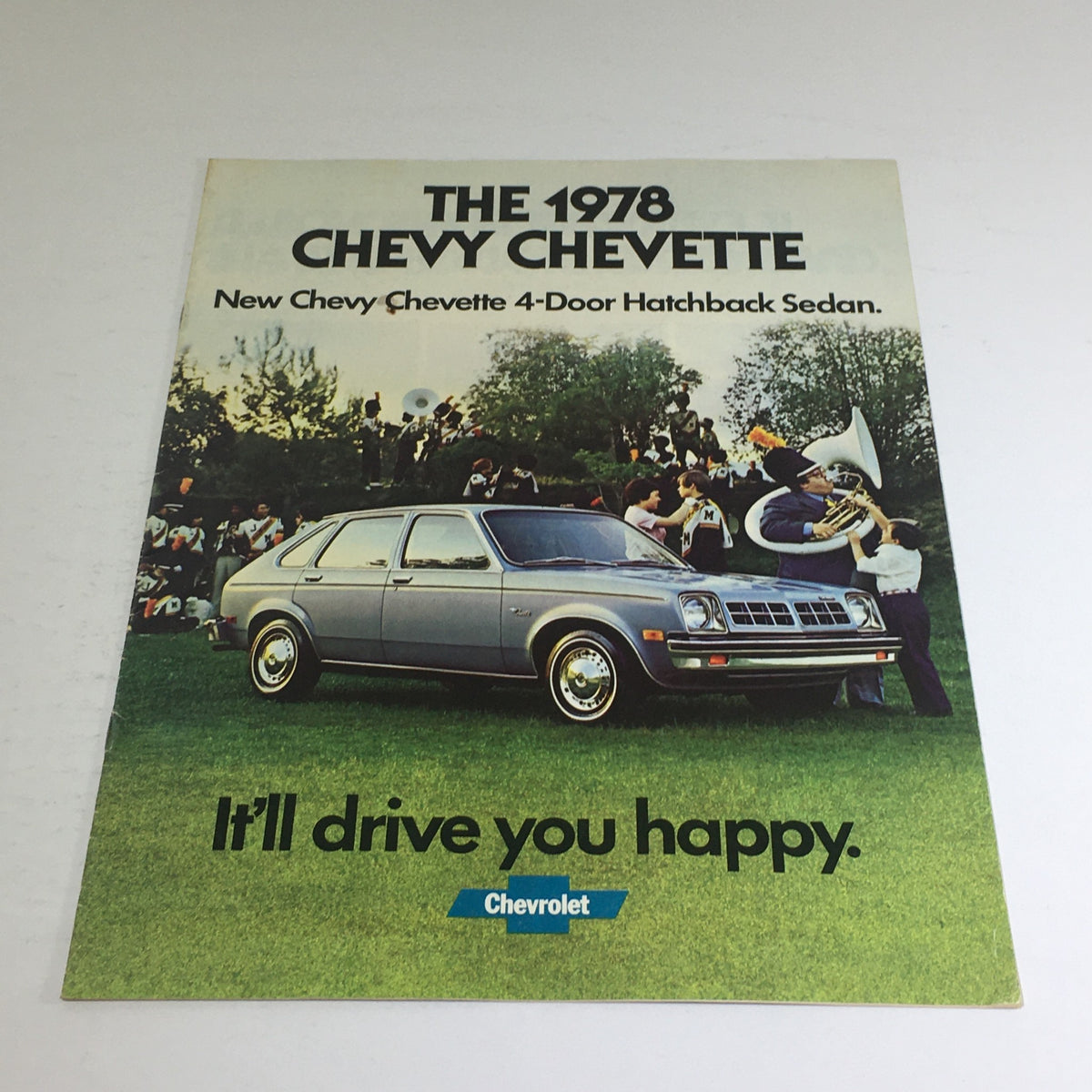 1978 Chevy Chevette Sedan advertisement showcasing the new Chevy Chevette 4-Door Hatchback, featuring promotional text and imagery reflecting the automotive style and culture of the late 1970s.