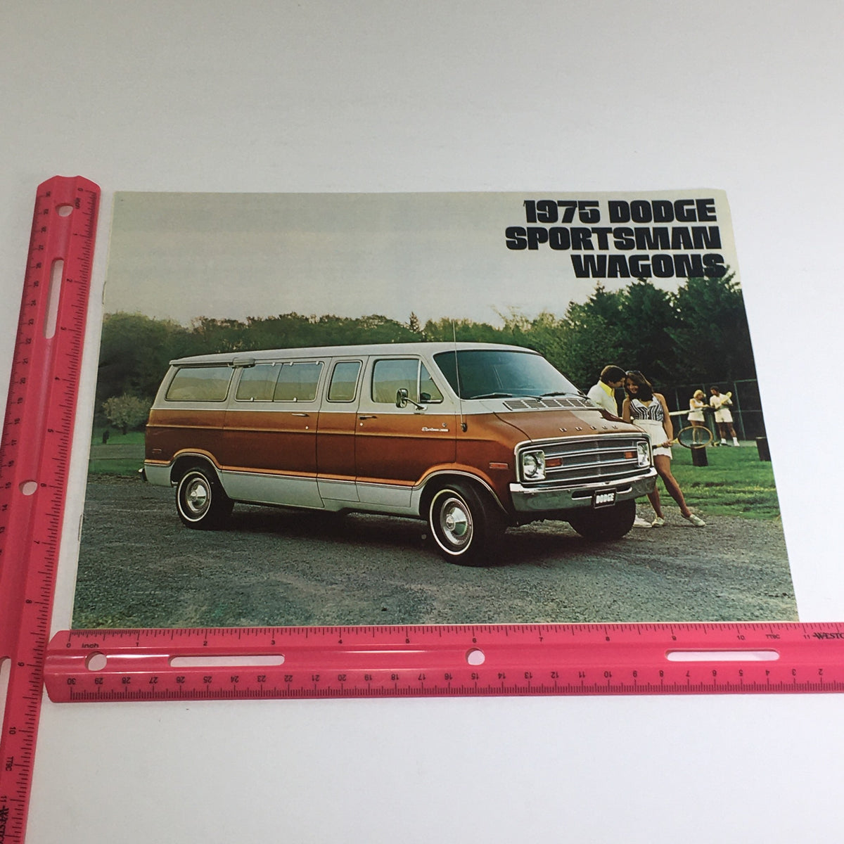 1975 Dodge Sportsman Wagons Optional Equipment Car Auto Brochure Catalog featuring a vintage Dodge Sportsman wagon parked in a scenic outdoor setting, with people enjoying leisure activities.