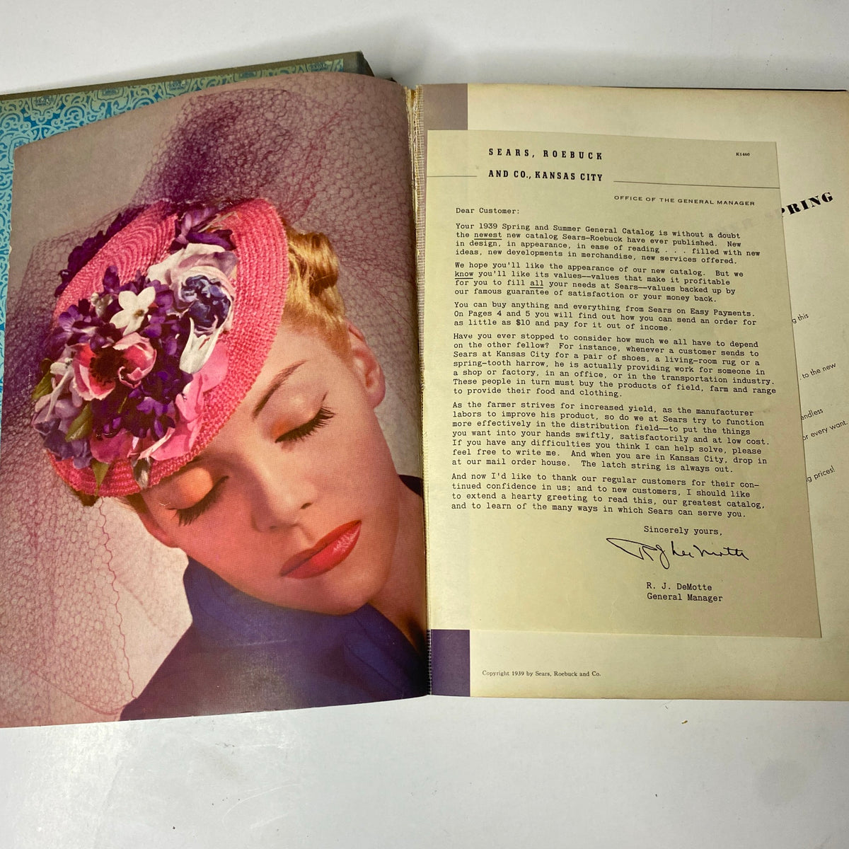 A vintage advertisement page from the 1939 Sears, Roebuck and Company Spring and Summer Hardcover Catalog, featuring a model wearing a decorative hat with vibrant colors.