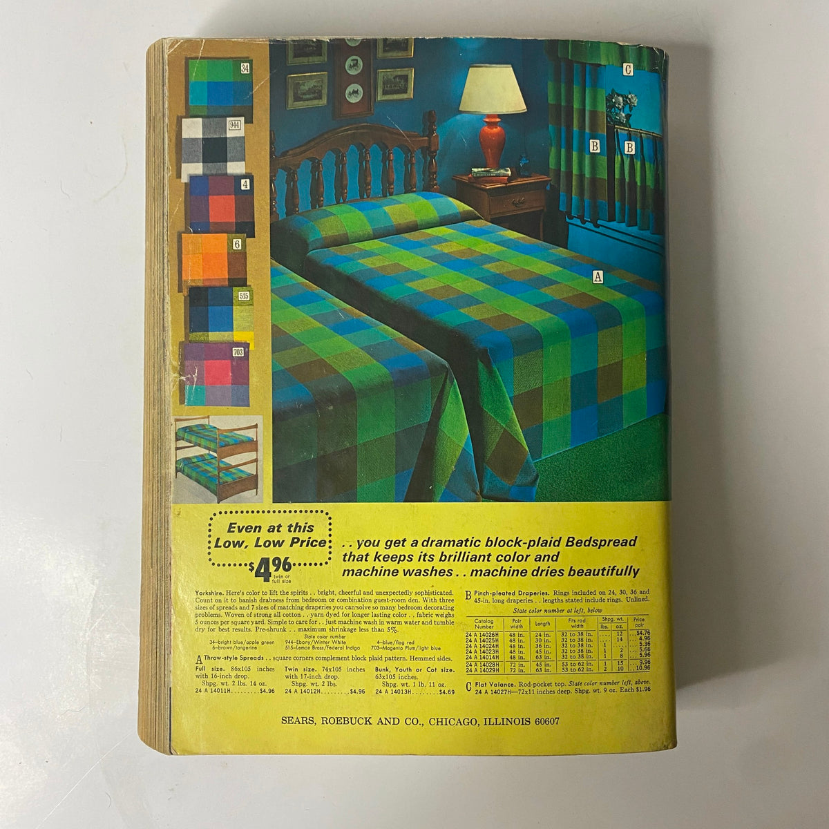 1971 Sears Roebuck and Co. Spring and Summer Catalog featuring a colorful block-plaid bedspread design on a bed, accompanied by matching curtains, showcasing vintage home decor styles from the early 1970s.