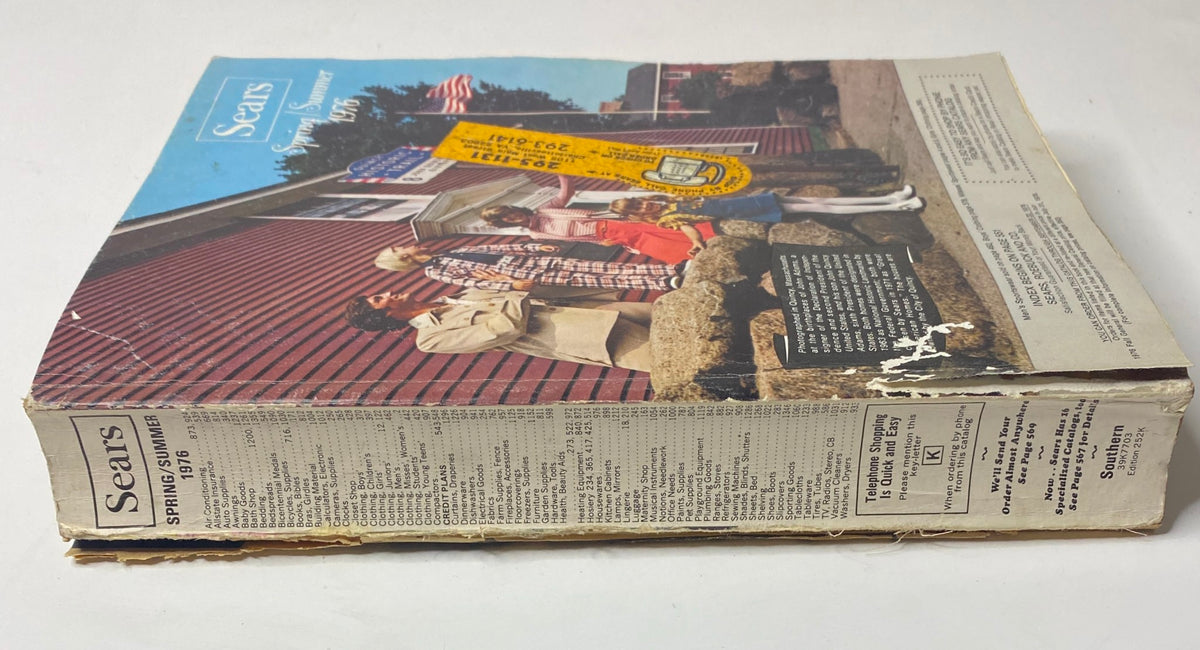 1976 Sears Spring and Summer Catalog GD Interior showing the spine of the vintage catalog, displaying signs of wear and nostalgia.