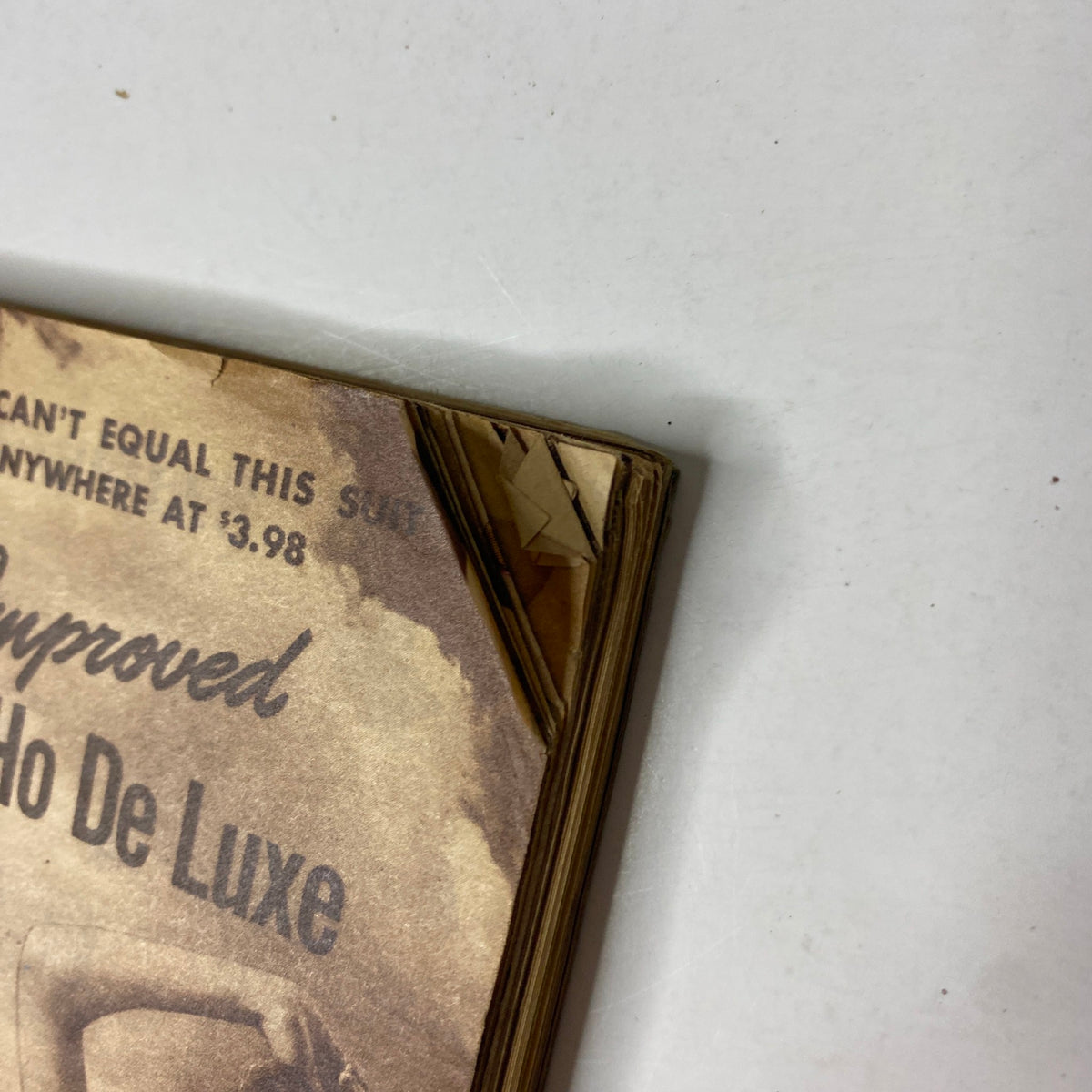 Detailed view of the corner of the 1941 Sears Midsummer Sale Catalog, showcasing vintage wear and condition.