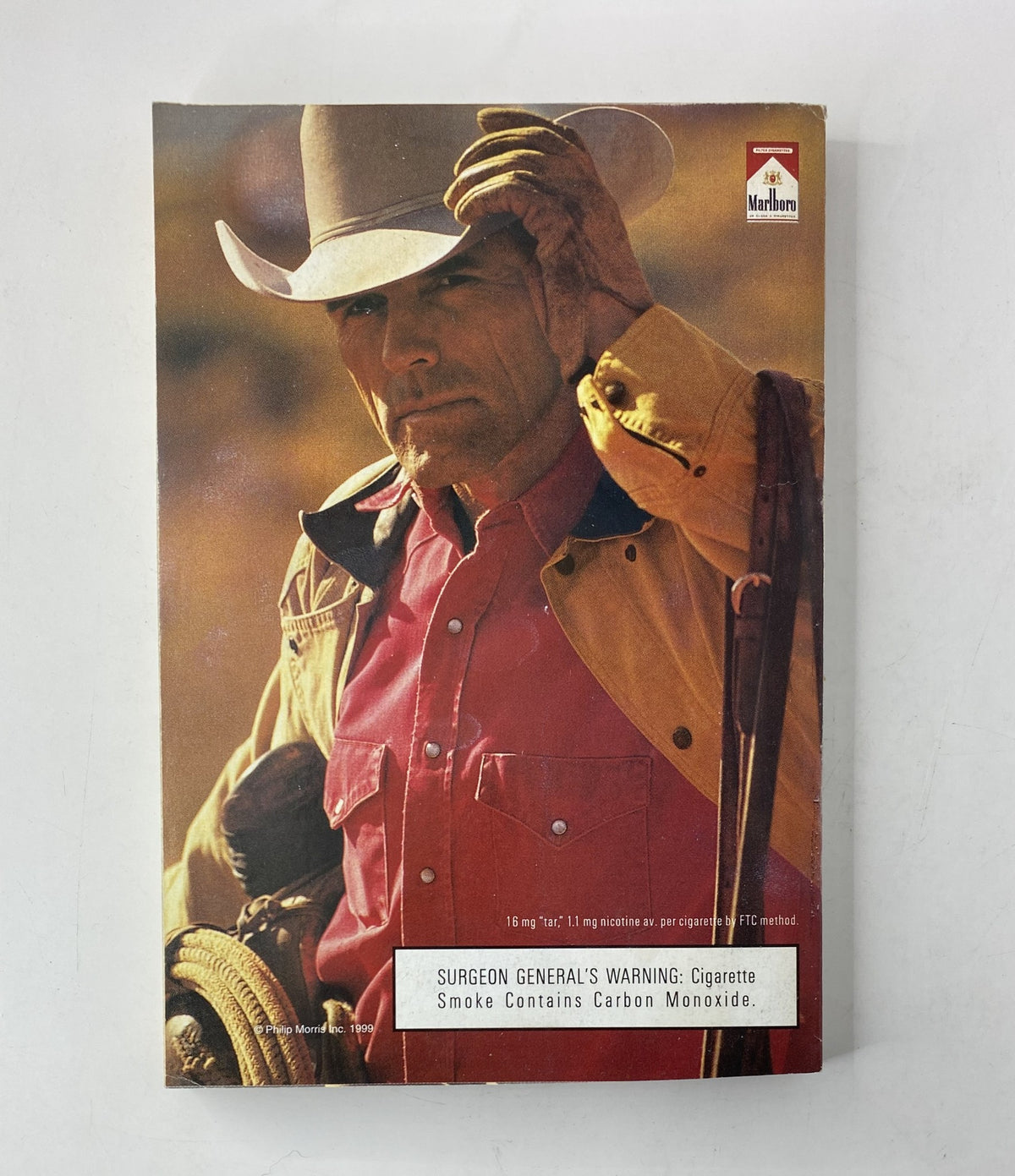 Vintage advertisement featuring a cowboy holding a hat, with a Surgeon General's warning about cigarette smoking at the bottom. Title: TV Guide Magazine November 13, 1999 James Bond Pierce Brosnan CO Ed. VG.