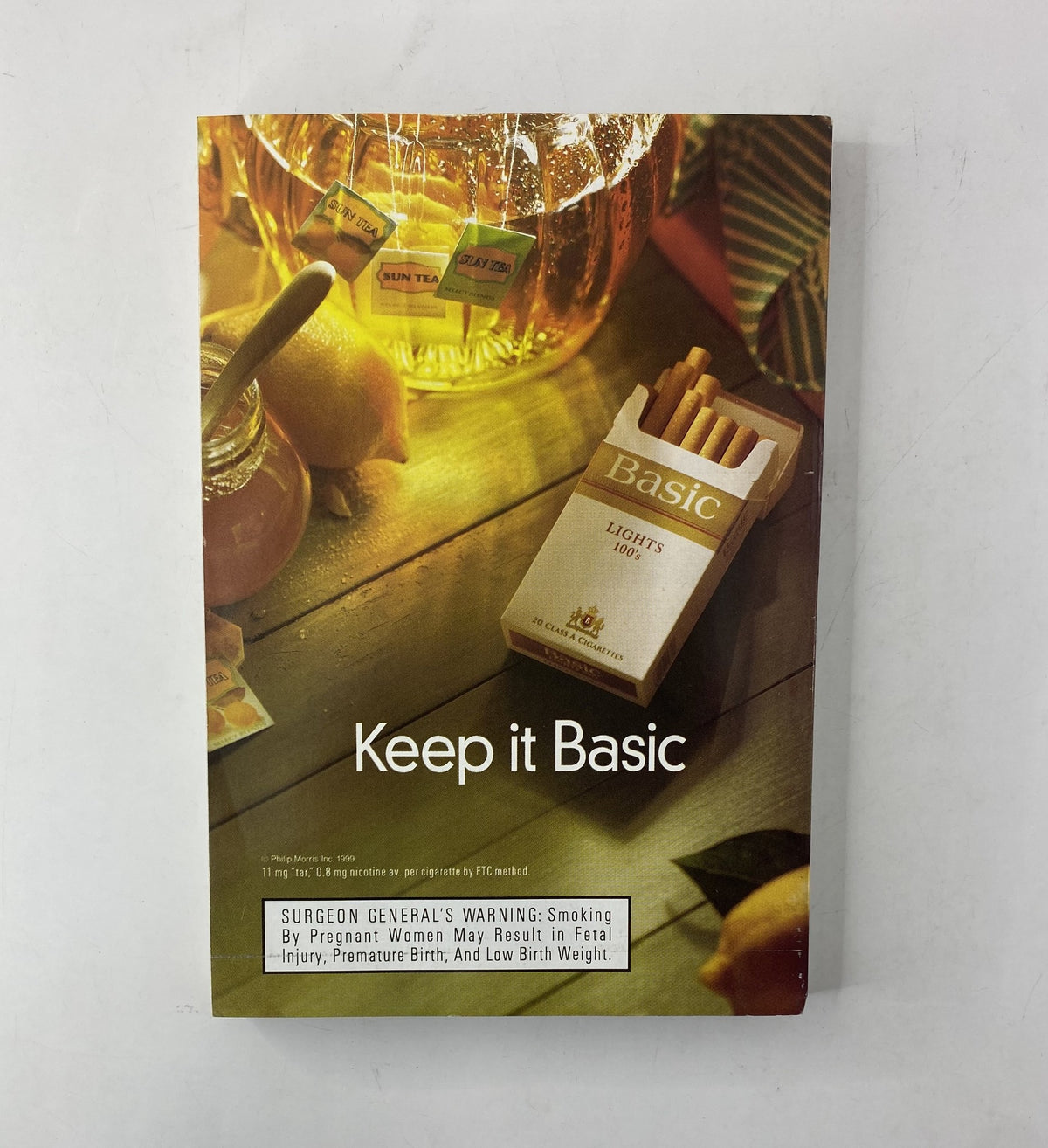 Advertisement from the back cover of TV Guide Magazine May 15, 1999 promoting Basic Lights cigarettes with a cautionary health message.
