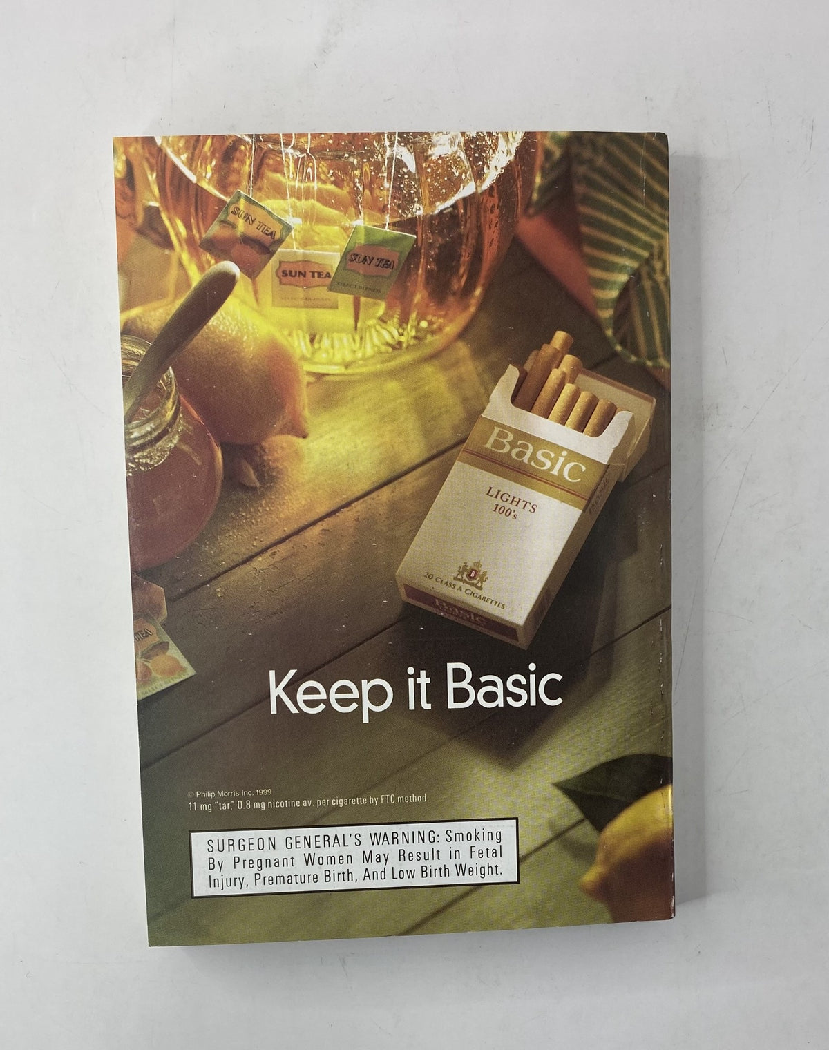 TV Guide Magazine May 15, 1999 advertisement for Basic cigarettes with a warning label highlighting health risks associated with smoking.