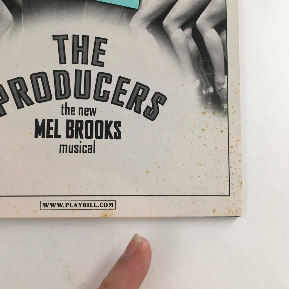 Cover of the 2003 Playbill for 'The Producers' by Mel Brooks, showcasing iconic artwork and title details.