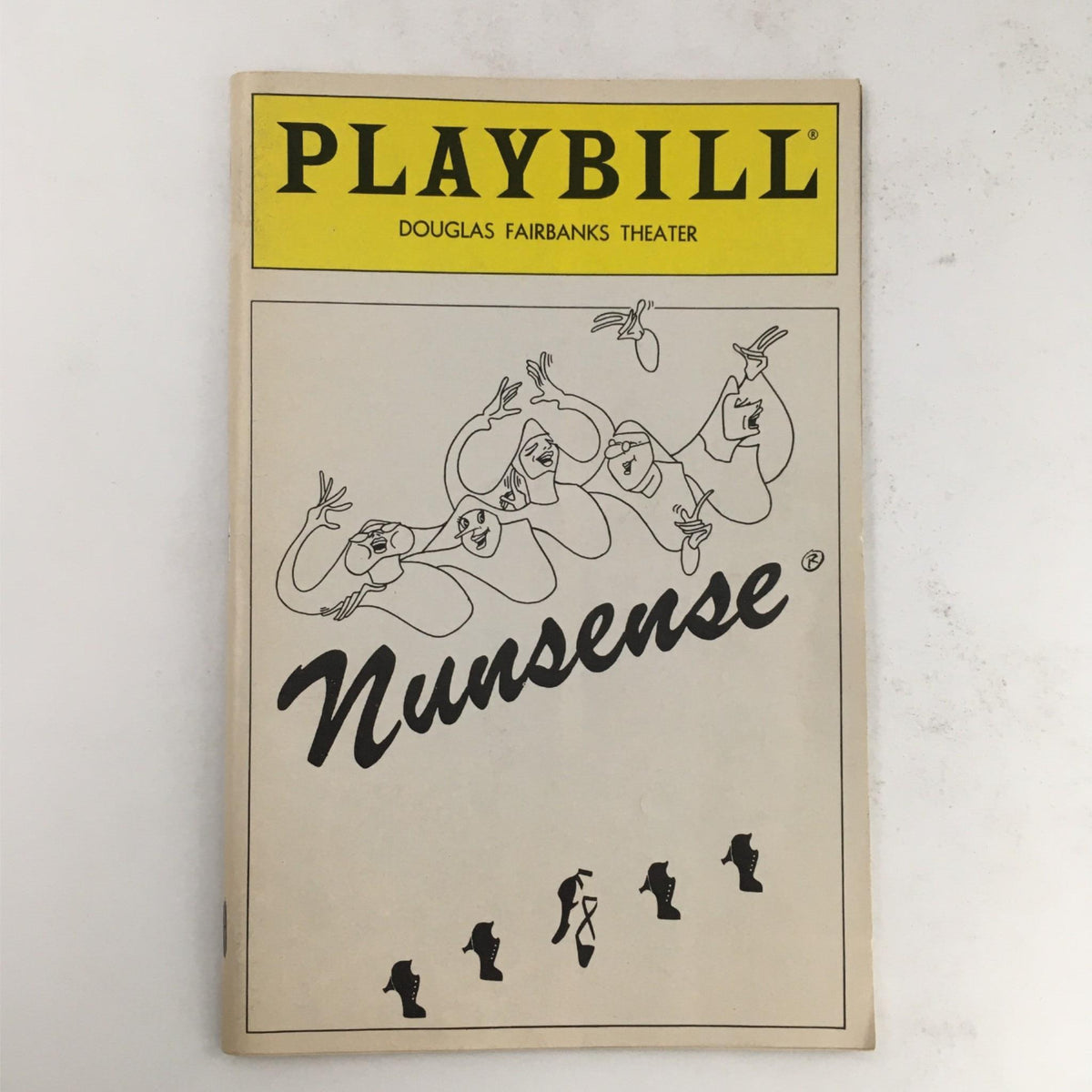 1987 Playbill for Nunsense by Dan Goggin, featuring whimsical illustrations of nuns, at Douglas Fairbanks Theatre.