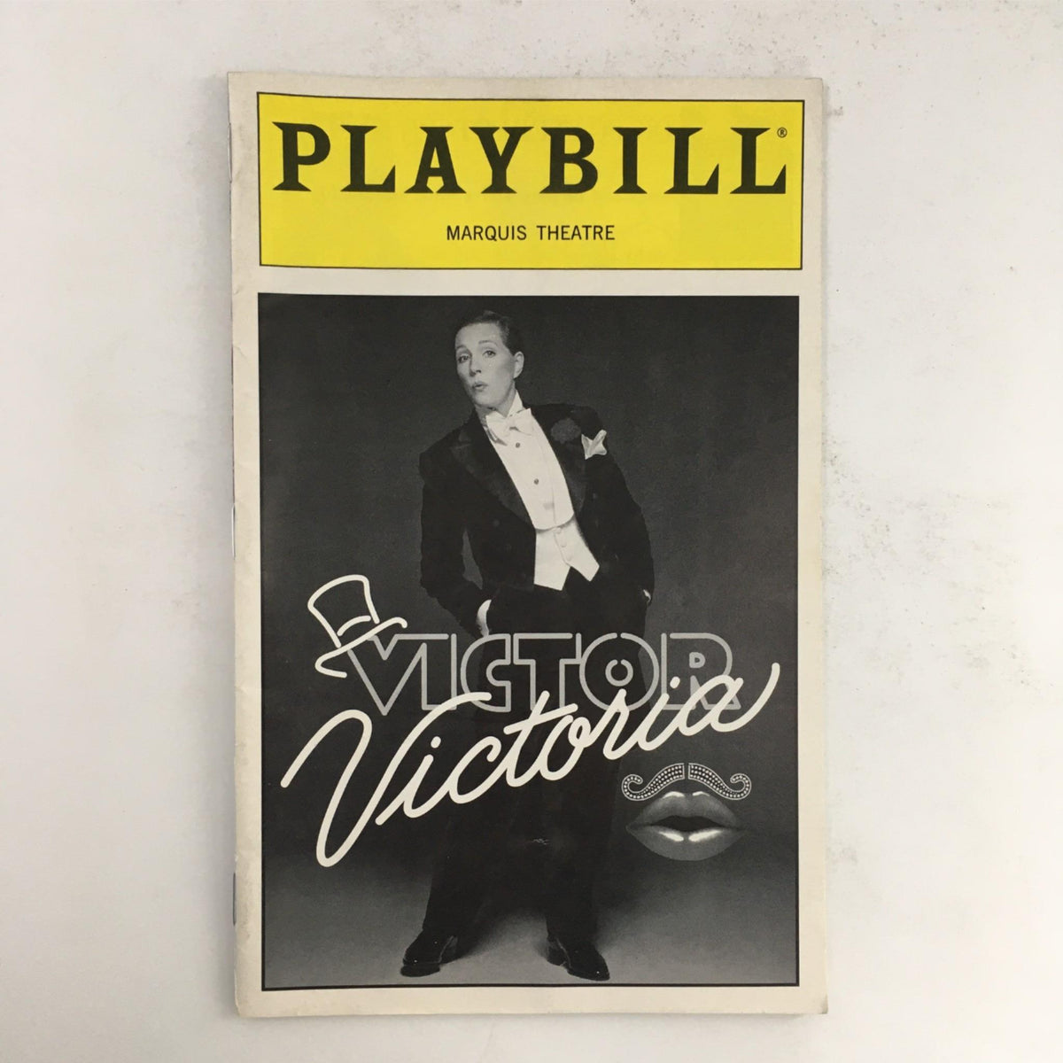 1997 Playbill Victor/Victoria by Blake Edwards, Rob Marshall at Marquis Theatre featuring a black and white cover image of the main character in a tuxedo.