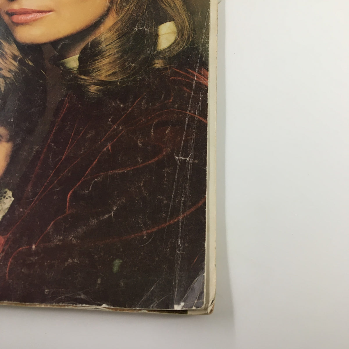 Side view of the Ladies' Home Journal Magazine, November 1967 issue, revealing its spine and cover wear, highlighting its vintage nature.