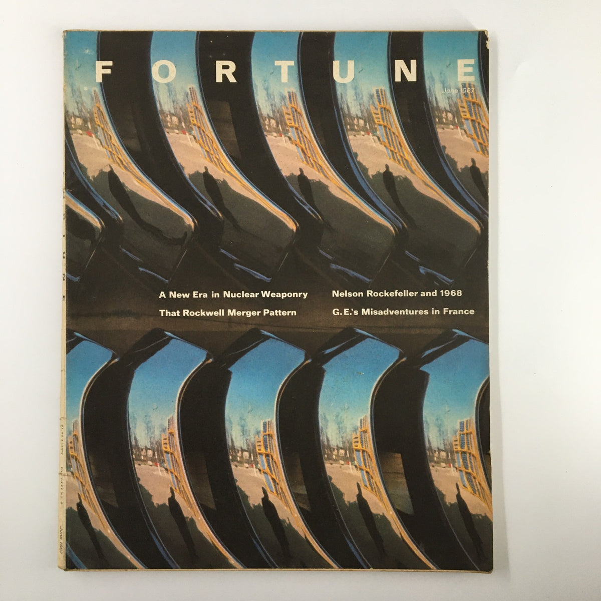 Cover of VTG Fortune Magazine June 1967 featuring Nelson Rockefeller and the events of 1968, showcasing a reflective design and headlines about nuclear weaponry, mergers, and misadventures in France.