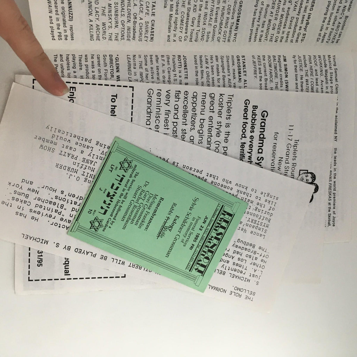 Image of promotional materials for '1995 Grandma Sylvia's Funeral' by Dana Matthow and Glenn Wein, including a green ticket and newspaper clippings, showcasing details of the production at SoHo Playhouse.