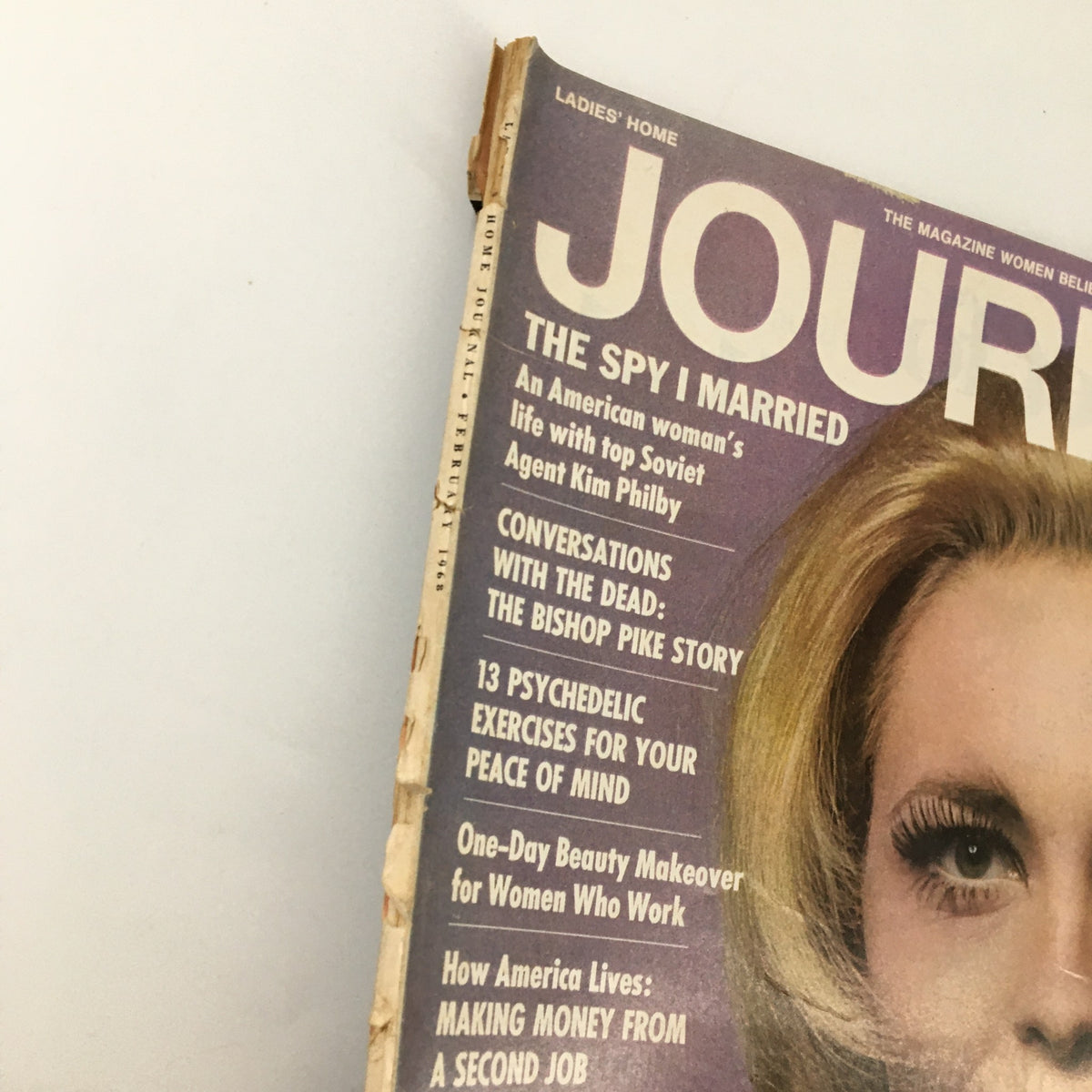 Close-up view of the February 1968 Ladies' Home Journal Magazine cover featuring Faye Dunaway as Bonnie, displaying details of featured articles and vintage design aesthetic.