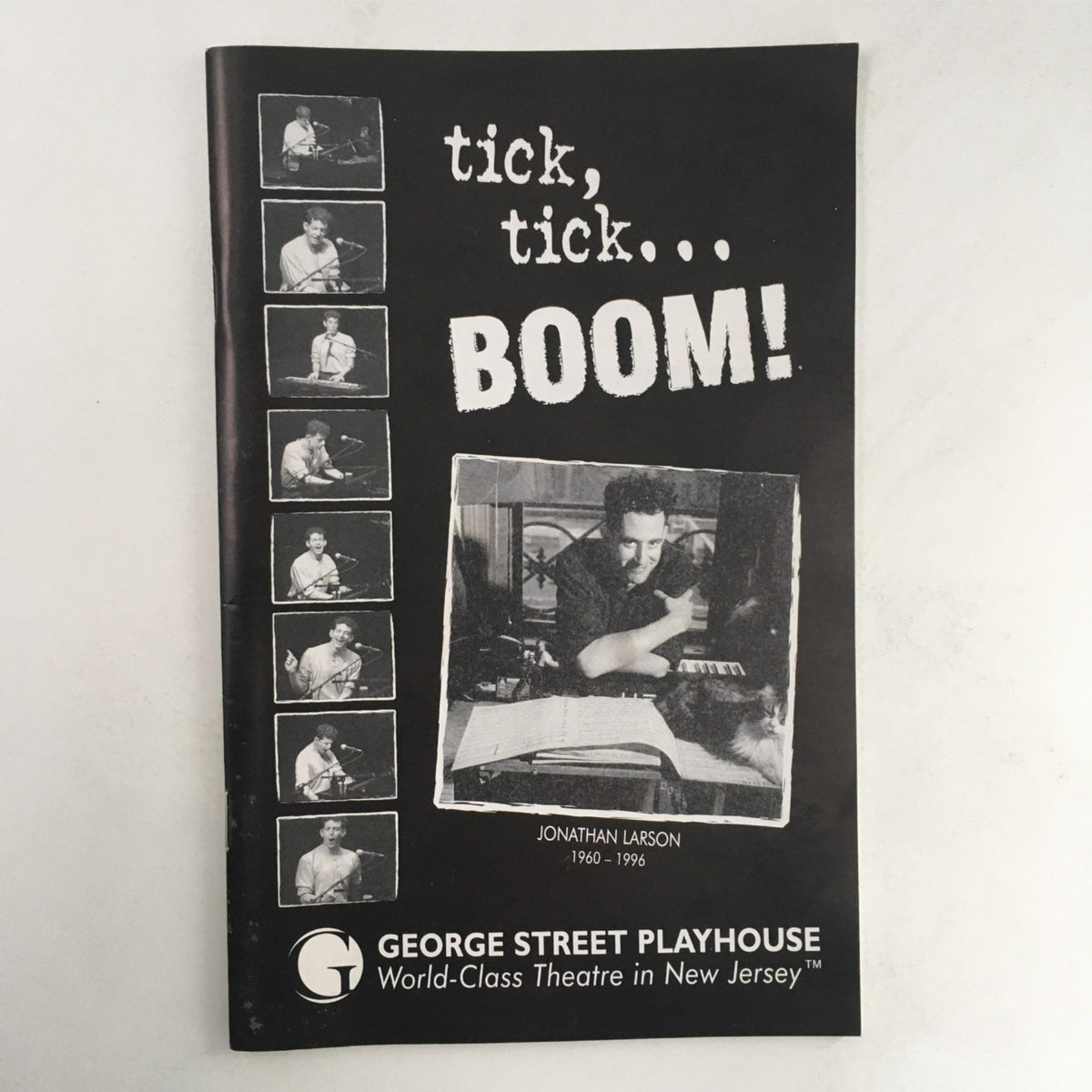 Cover of the 2004 Tick, Tick... Boom! magazine featuring Jonathan Larson, showcasing a vintage design related to the George Street Playhouse production.