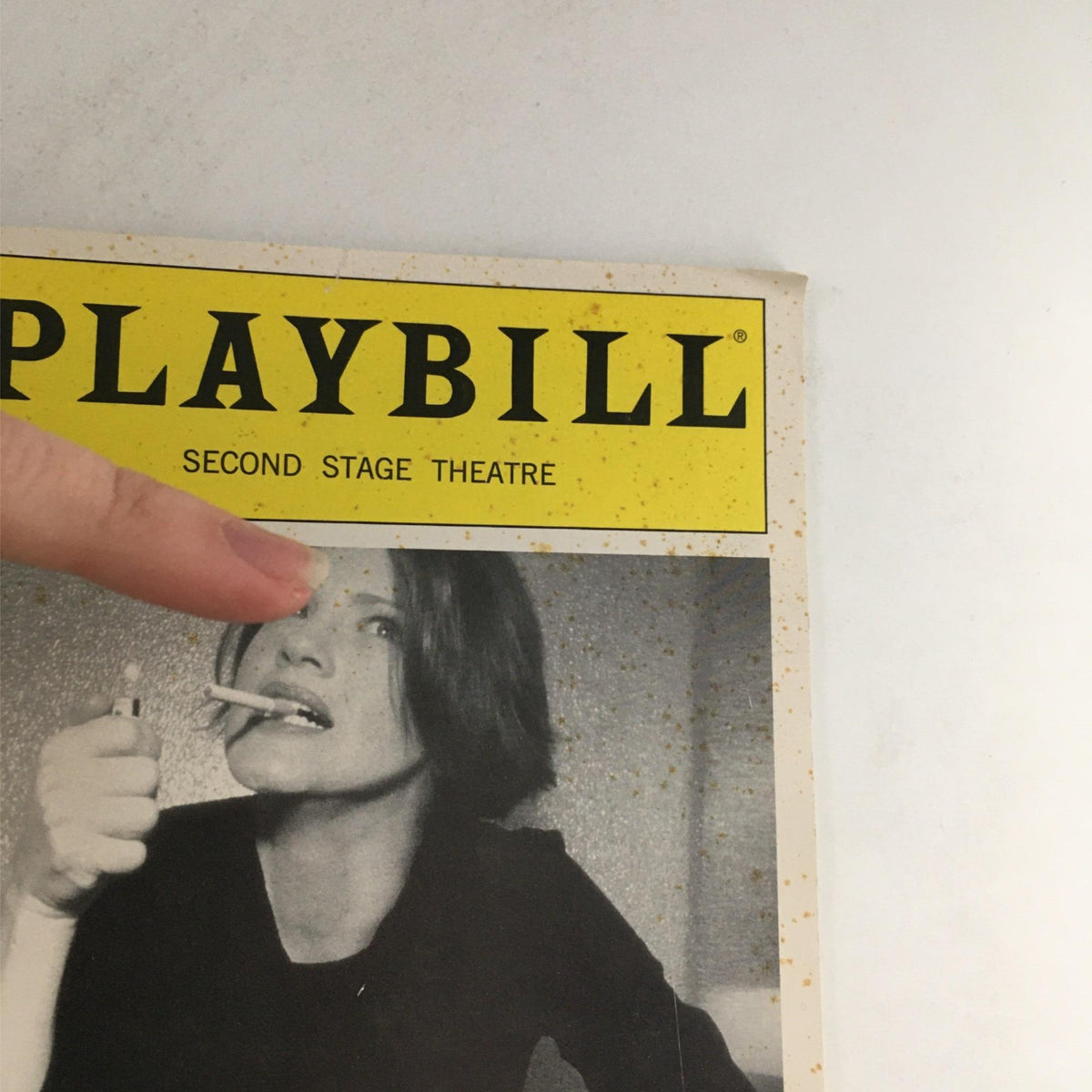 Front cover of the 2003 Playbill Little Fish by Michael John LaChiusa at Second Stage Theatre, featuring an actress with a cigarette, set in a vintage design.