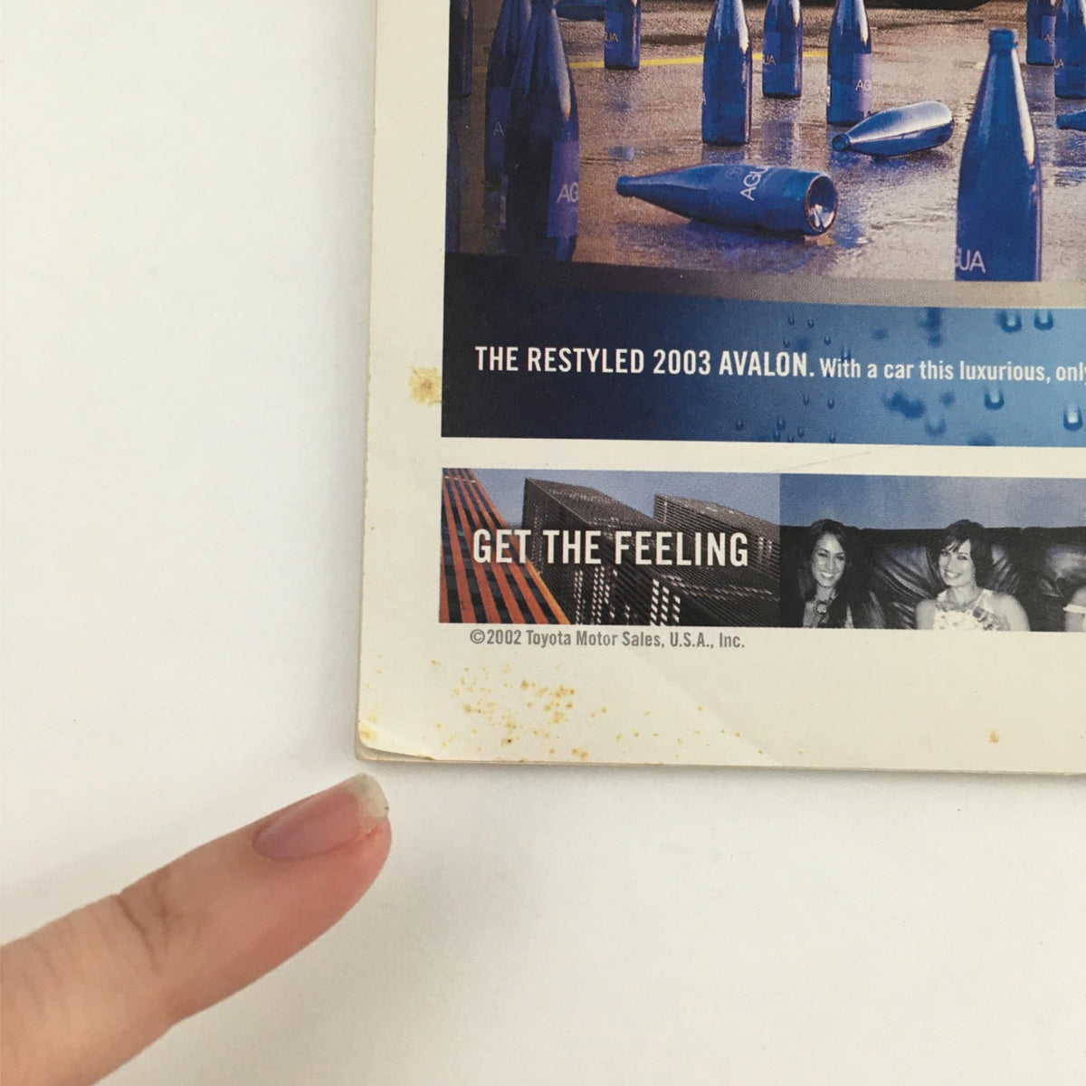Back cover of the 2003 Playbill Little Fish by Michael John LaChiusa, with advertising for the 2003 Toyota Avalon amidst subtle wear marks.