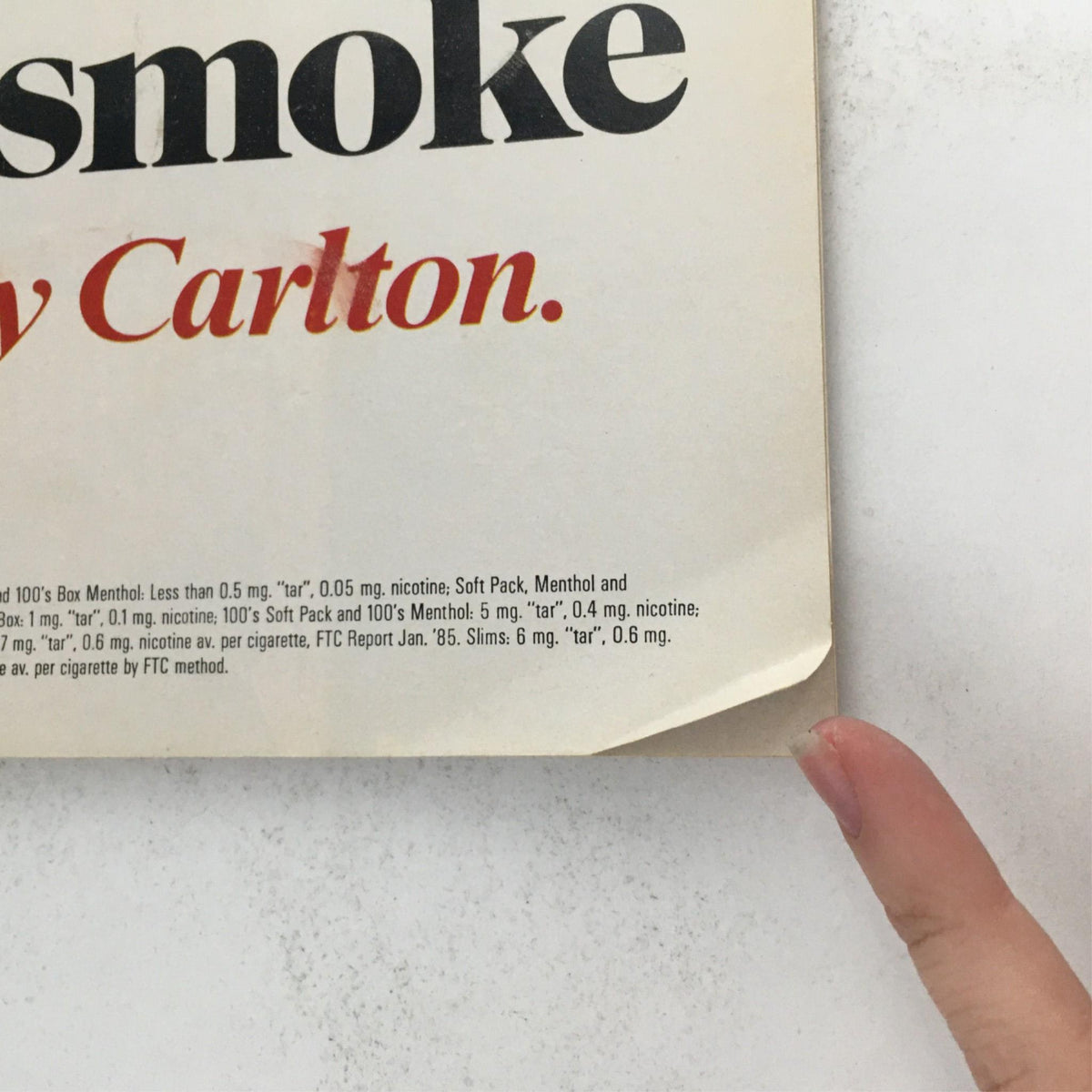 Close-up of lower corner of 1985 Playbill for The Odd Couple, displaying advertisement related to smoking.
