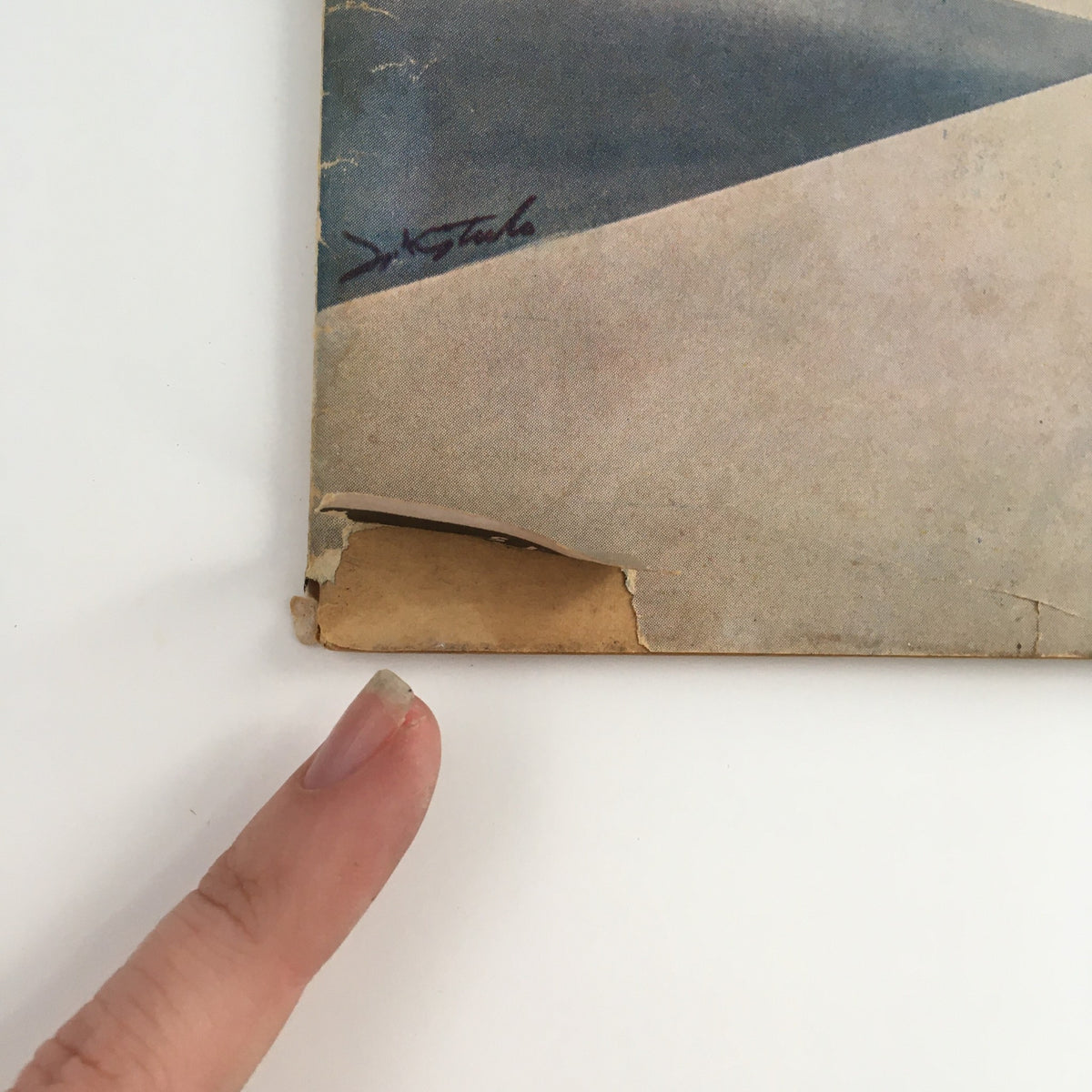 Close-up of the bottom corner of the Model Airplane News Magazine July 1950, showing minor wear and tear on the cover.