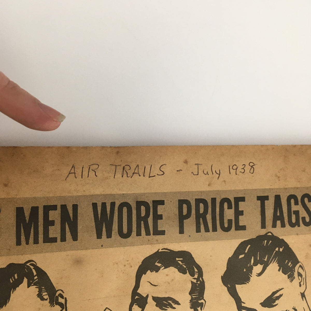 Top edge of a page in Air Trails Magazine July 1938 featuring the title and handwritten notes.