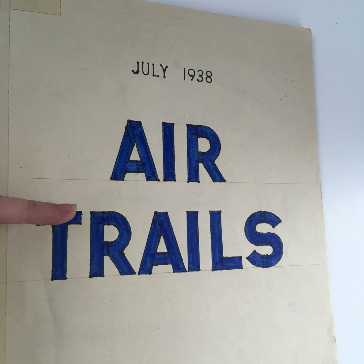 Highlighted title 'AIR TRAILS' on the cover of Air Trails Magazine July 1938, showcasing vintage typography.