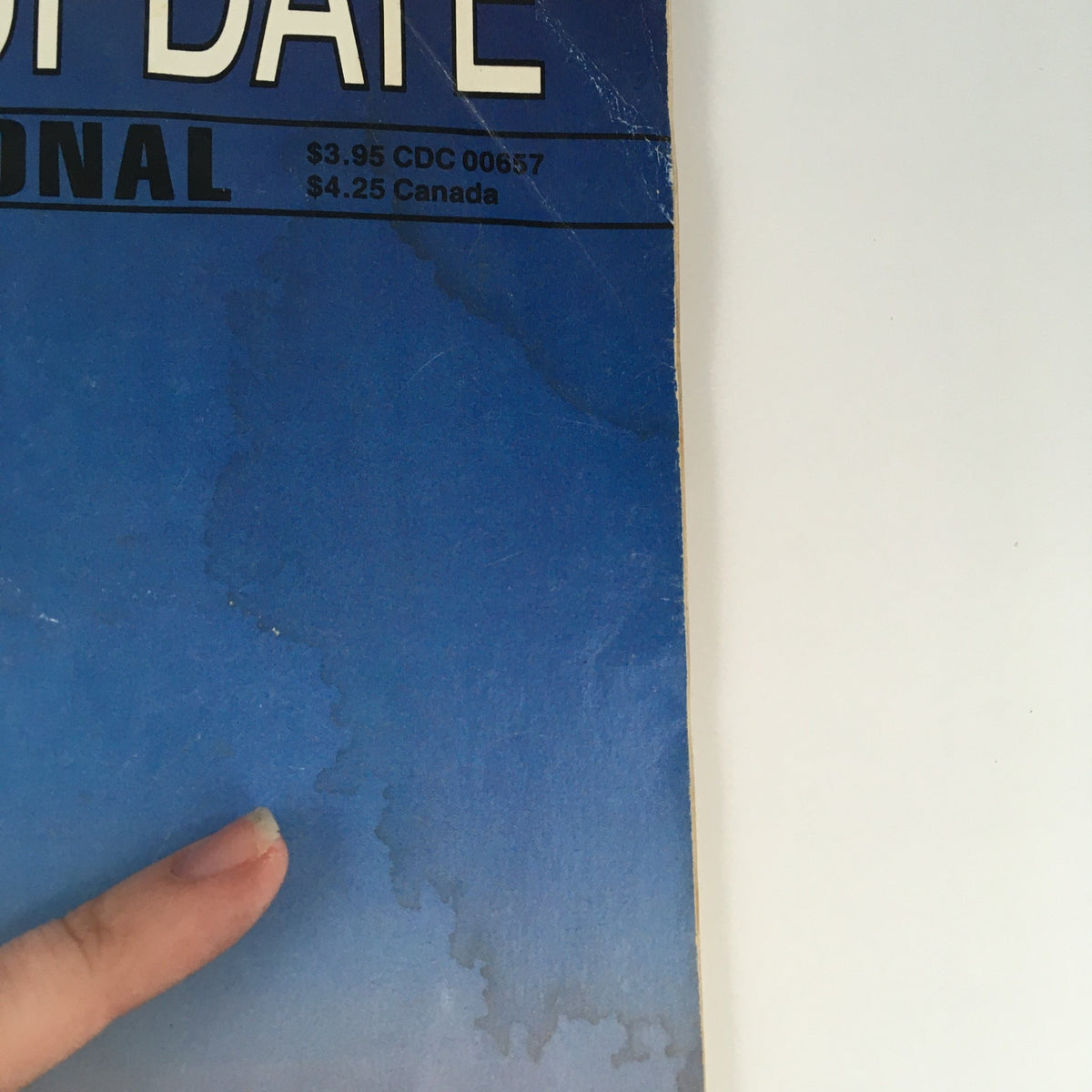 Side view of Defense Update International No. 99, 1990 emphasizing its vintage design and publication details.