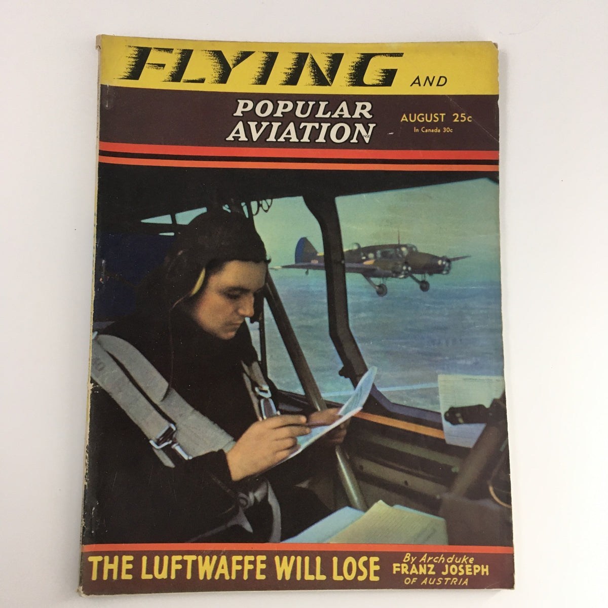 Cover of Flying & Popular Aviation Magazine, August 1941, Vol 24 #2 featuring a pilot reading inside an aircraft with the Canadian Avro 'Anson' in the background.