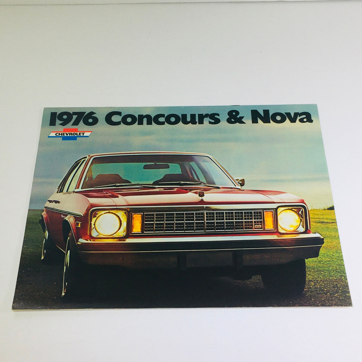 1976 Chevrolet Concours & Nova Dealership Car Auto Brochure Catalog cover featuring a red Chevrolet Concours parked in a scenic setting.