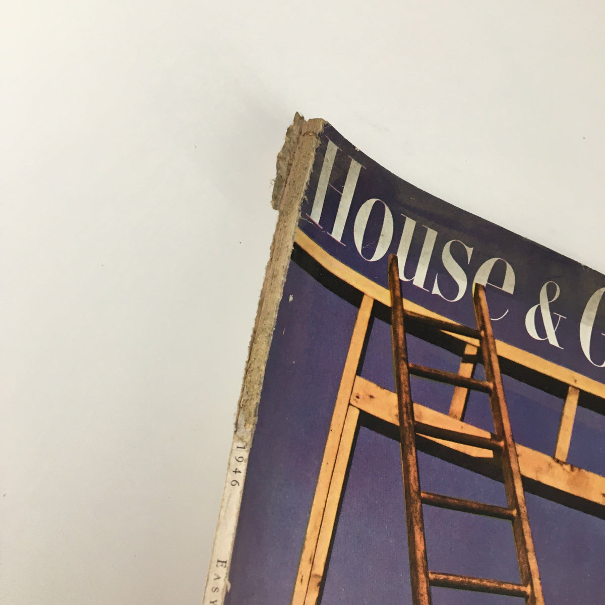 Close-up of the top edge of VTG House & Garden Magazine February 1946, highlighting vintage details and the ladder on the cover.