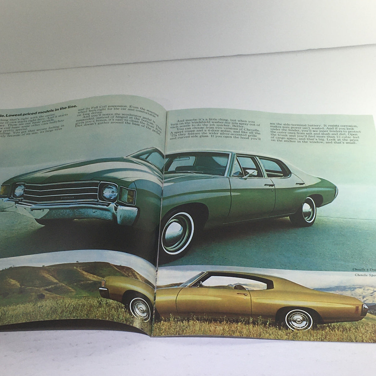 1972 Chevrolet Malibu/Chevelle/Chevy/SS Dealership Car Auto Brochure Catalog showing an open brochure with images of two 1972 Chevelle models against a scenic background.
