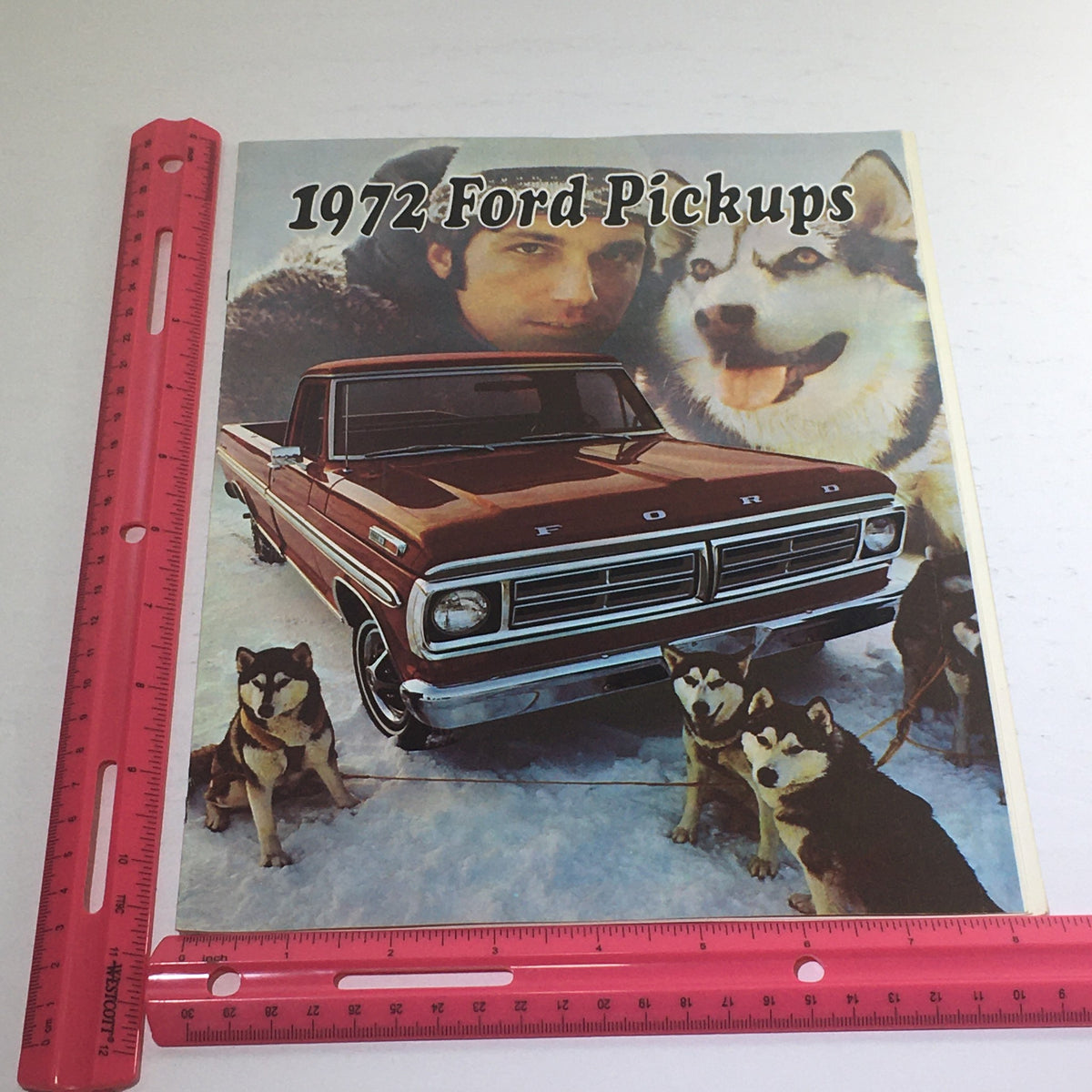 1972 Ford Pickups Colors & Combination Dealership Car Auto Brochure Catalog image featuring a red Ford pickup truck with snowy backdrop and husky dogs, along with a ruler for size reference.