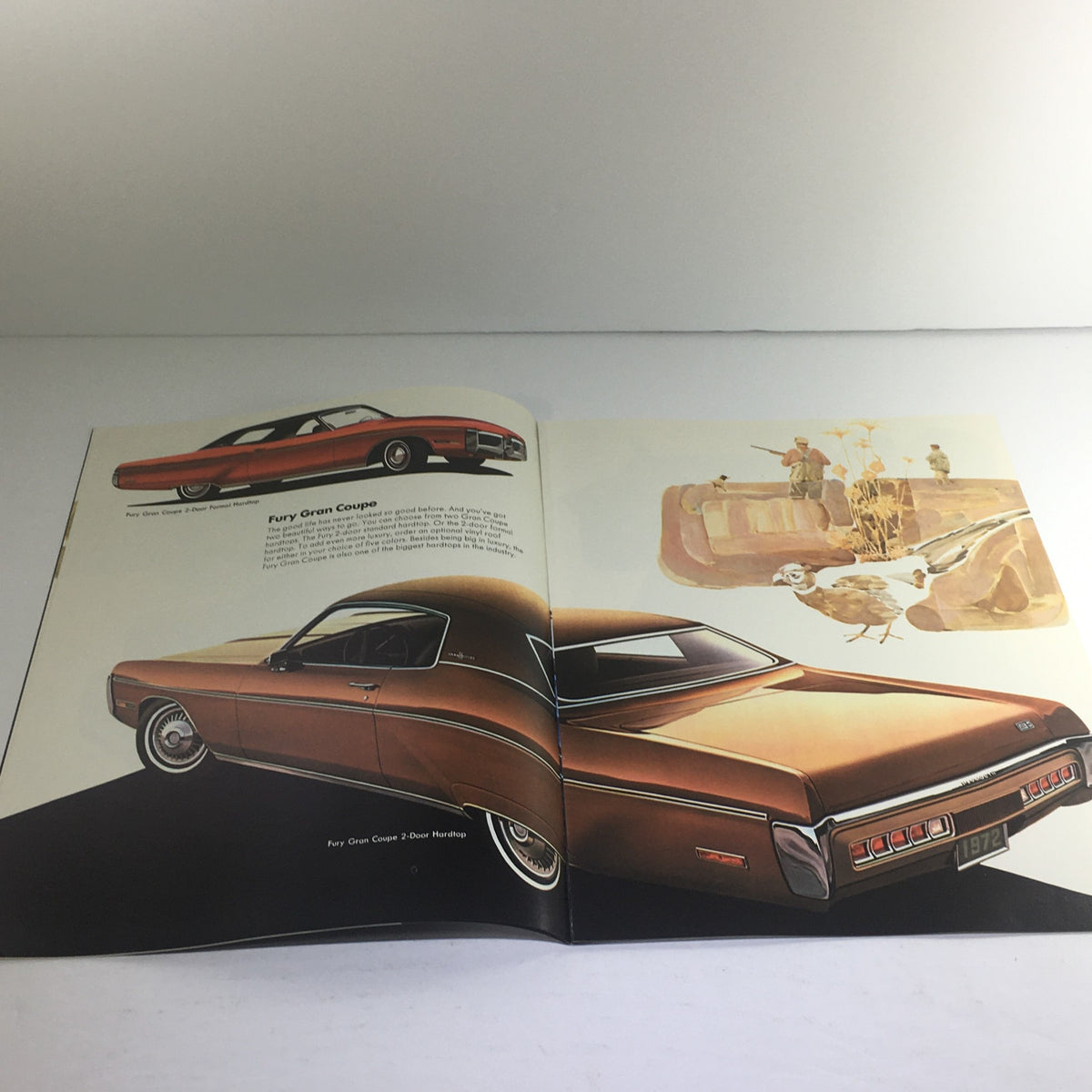1972 Plymouth-Chrysler Fury Gran Coupe dealership brochure interior showcasing two-tone Fury Gran Coupe models with illustrations.