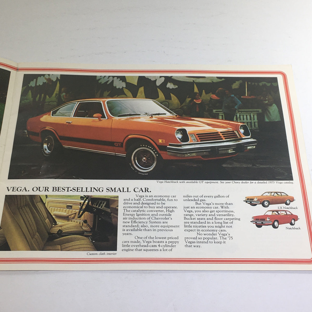 1975 Chevrolet full line Vega LX Notch-back Dealership Car Auto Brochure Catalog featuring the Vega model in bright orange color with interior and exterior views highlighted.