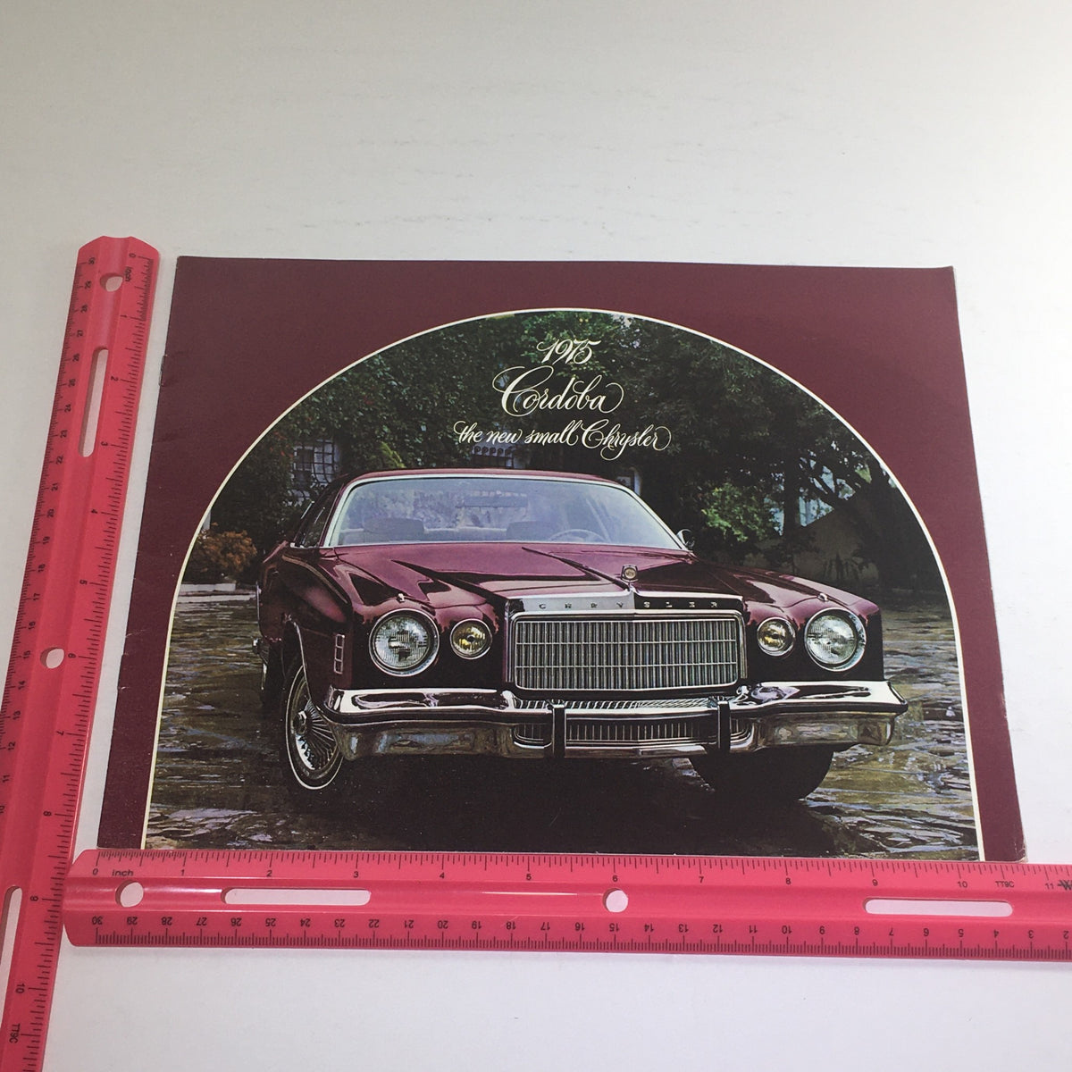 1975 Chrysler Cordoba Showroom Dealership Auto Brochure Catalog showcasing the 1975 Chrysler Cordoba in a picturesque setting.
