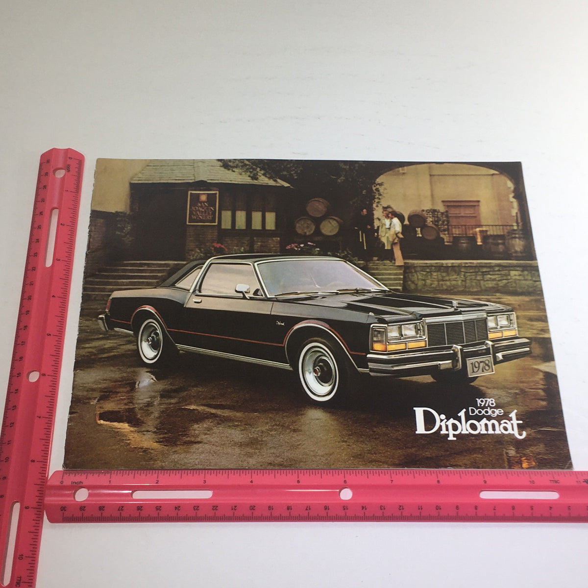 1978 Dodge Diplomat Medallion Dealership Advertising Car Auto Brochure Catalog displaying a black Dodge Diplomat parked with a house in the background.
