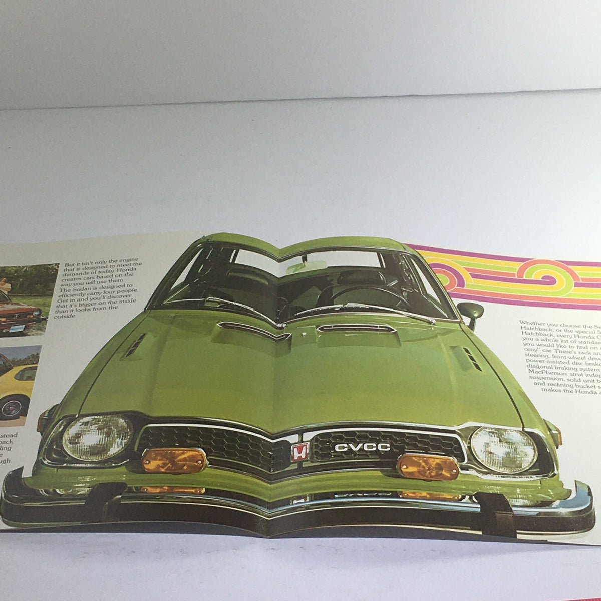 1975 Honda CVCC Specifications Dealership Car Auto Brochure showcasing a frontal view of the classic green Honda CVCC highlighting its unique features and vintage style.