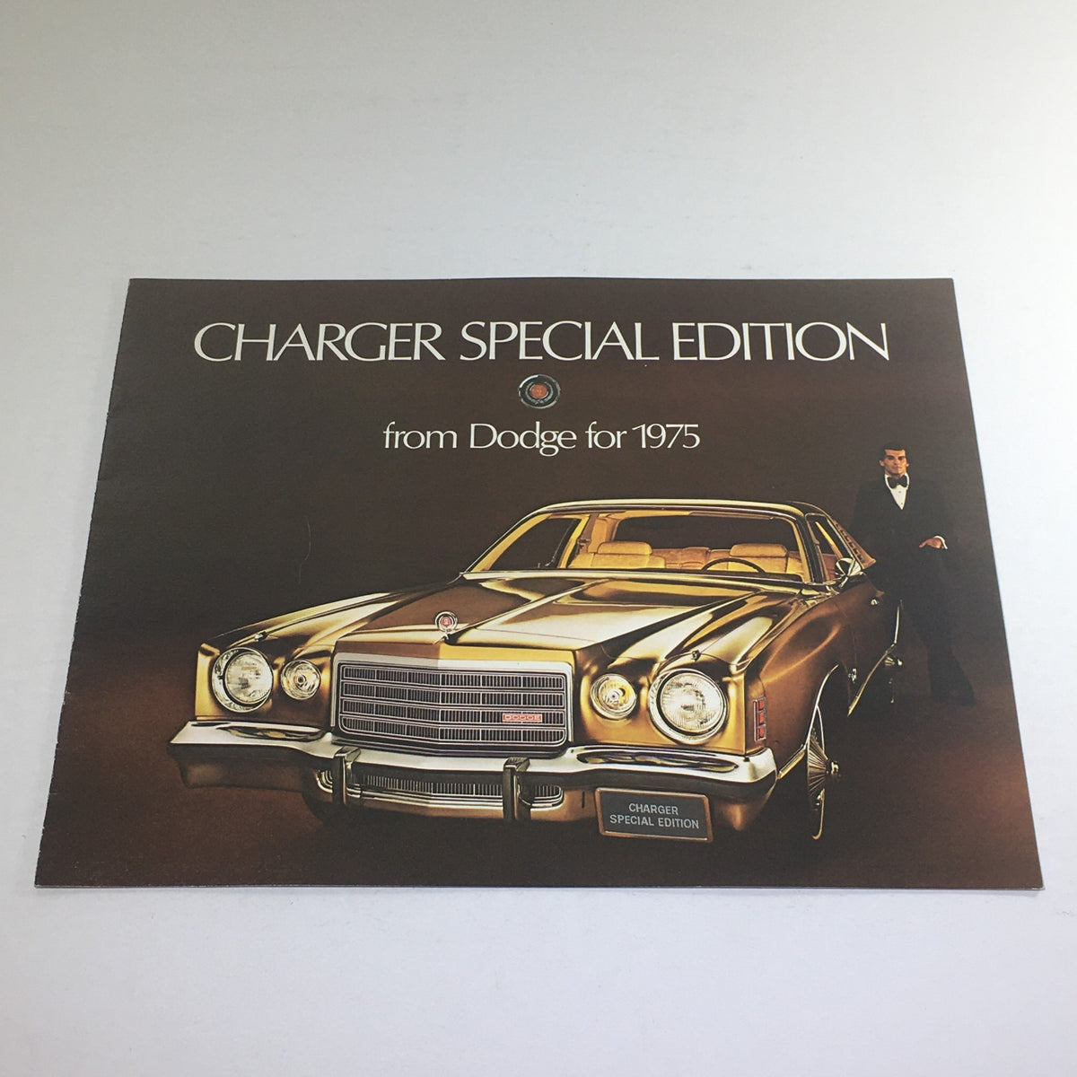 1975 Dodge Charger Special Edition Dealership Car Auto Brochure Catalog featuring a sleek brown Charger model with a sophisticated backdrop.